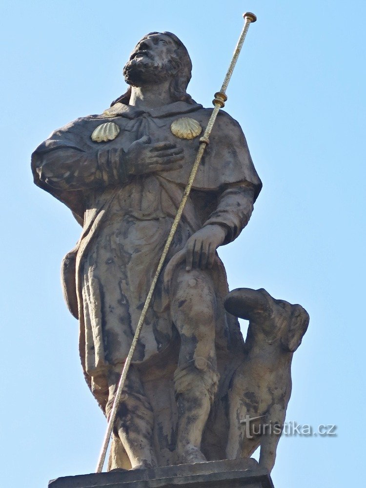 vrcholová socha sv. Rocha se psem