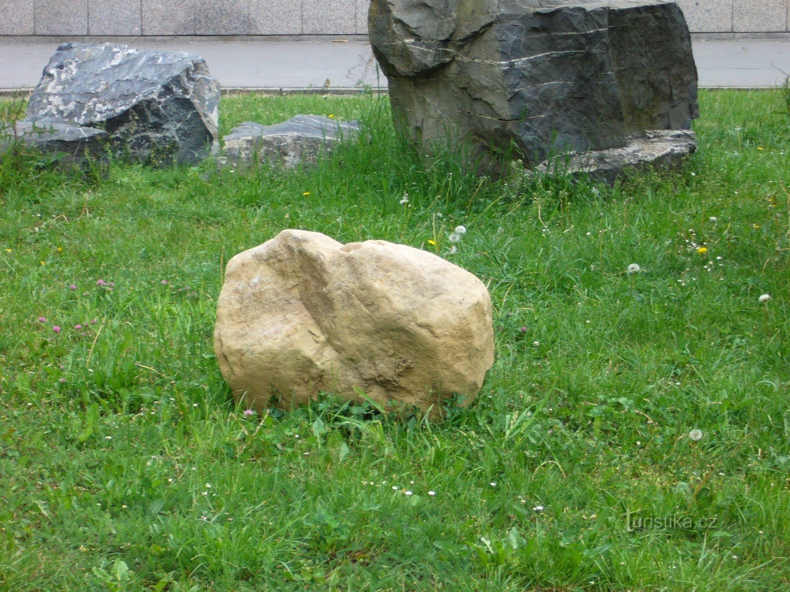 errant boulder in front of the entrance