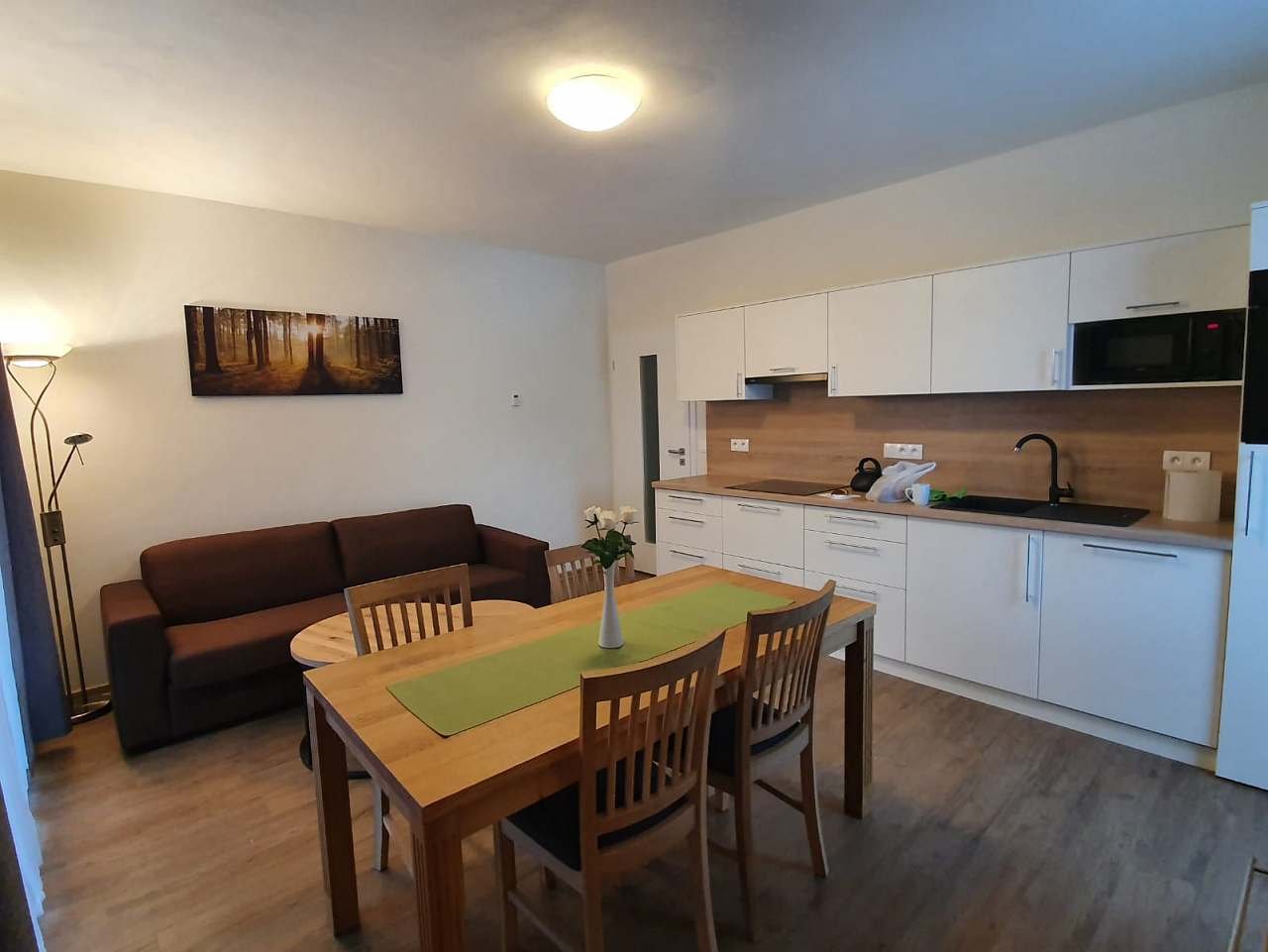 A view of the kitchen with the living area