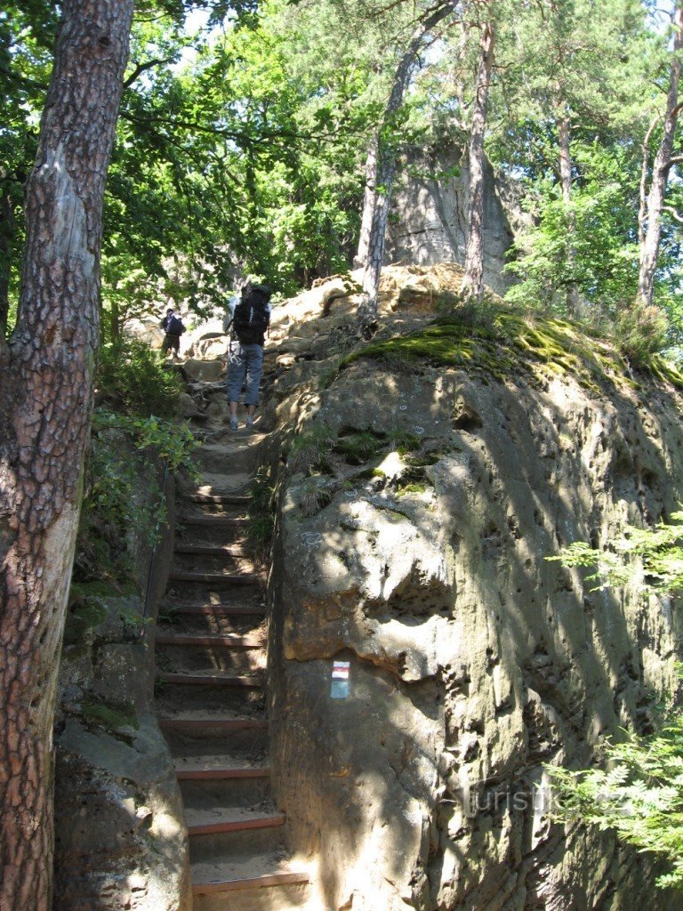 the path weaves through the rock massif