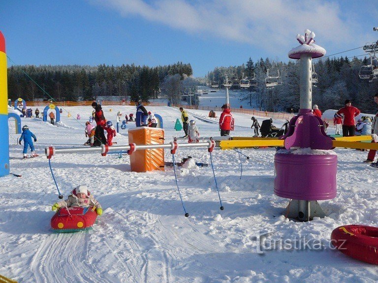 Captain Lipánek's Foxpark with the Jezerní ski slope in the background