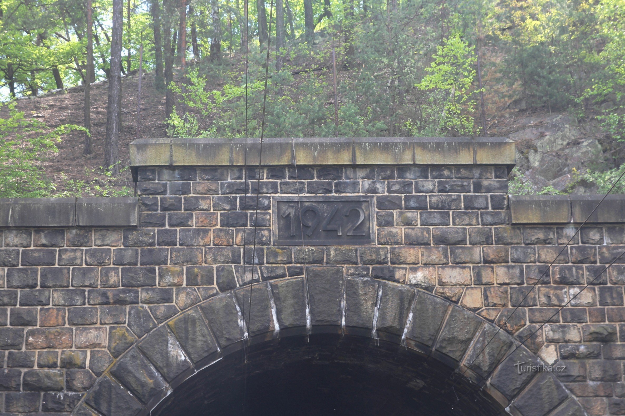 The upper part of the portal of one of the tunnels with the date of construction