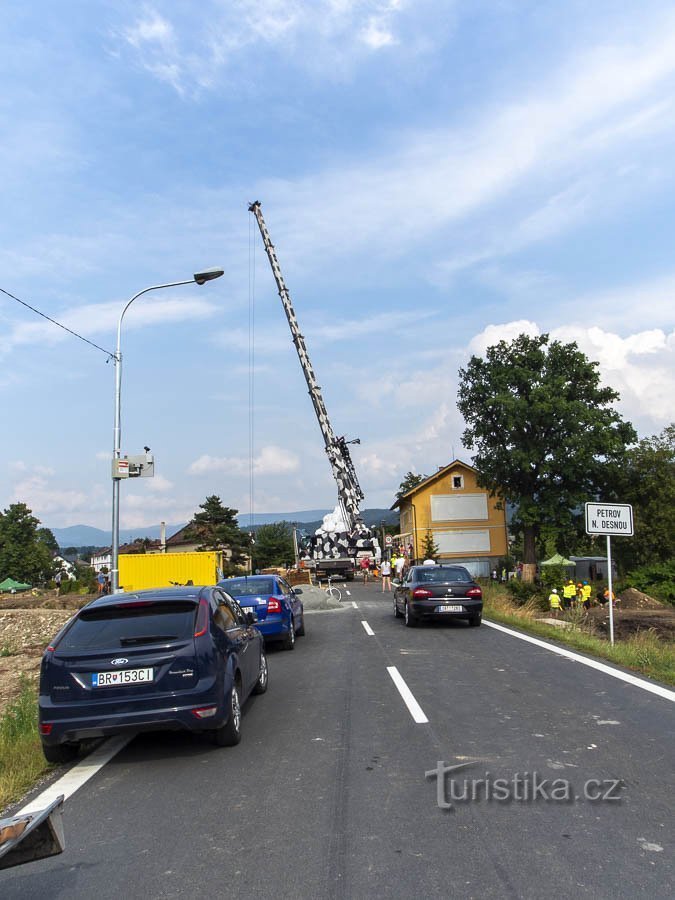 A crane on the right bank was stacking a load