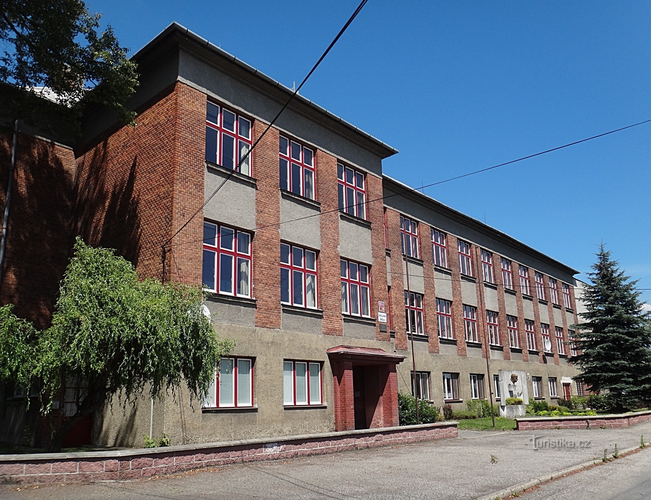 Jistebník TGM school with a bust of P. Bezruč