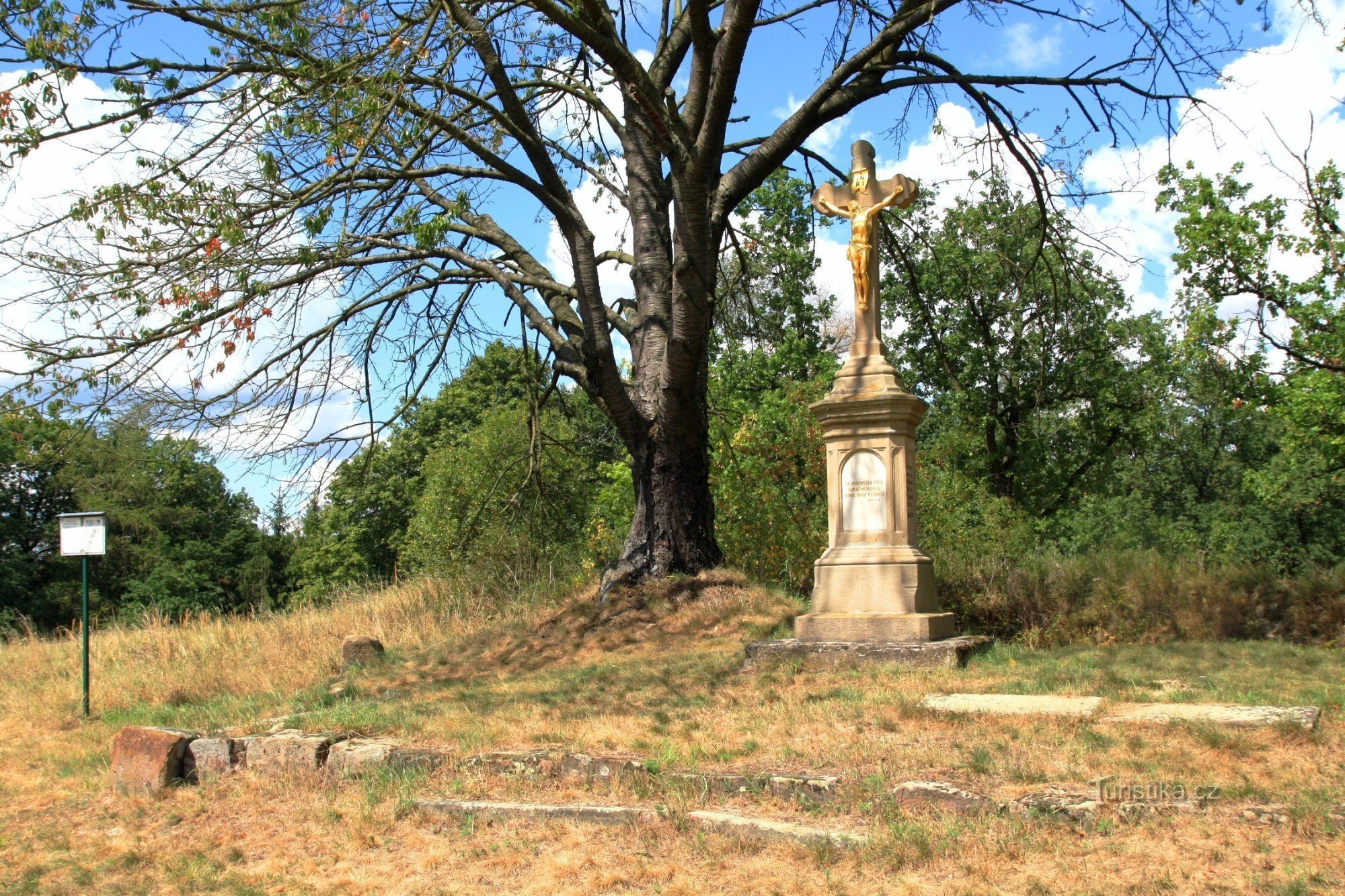 Stone cross at the former church