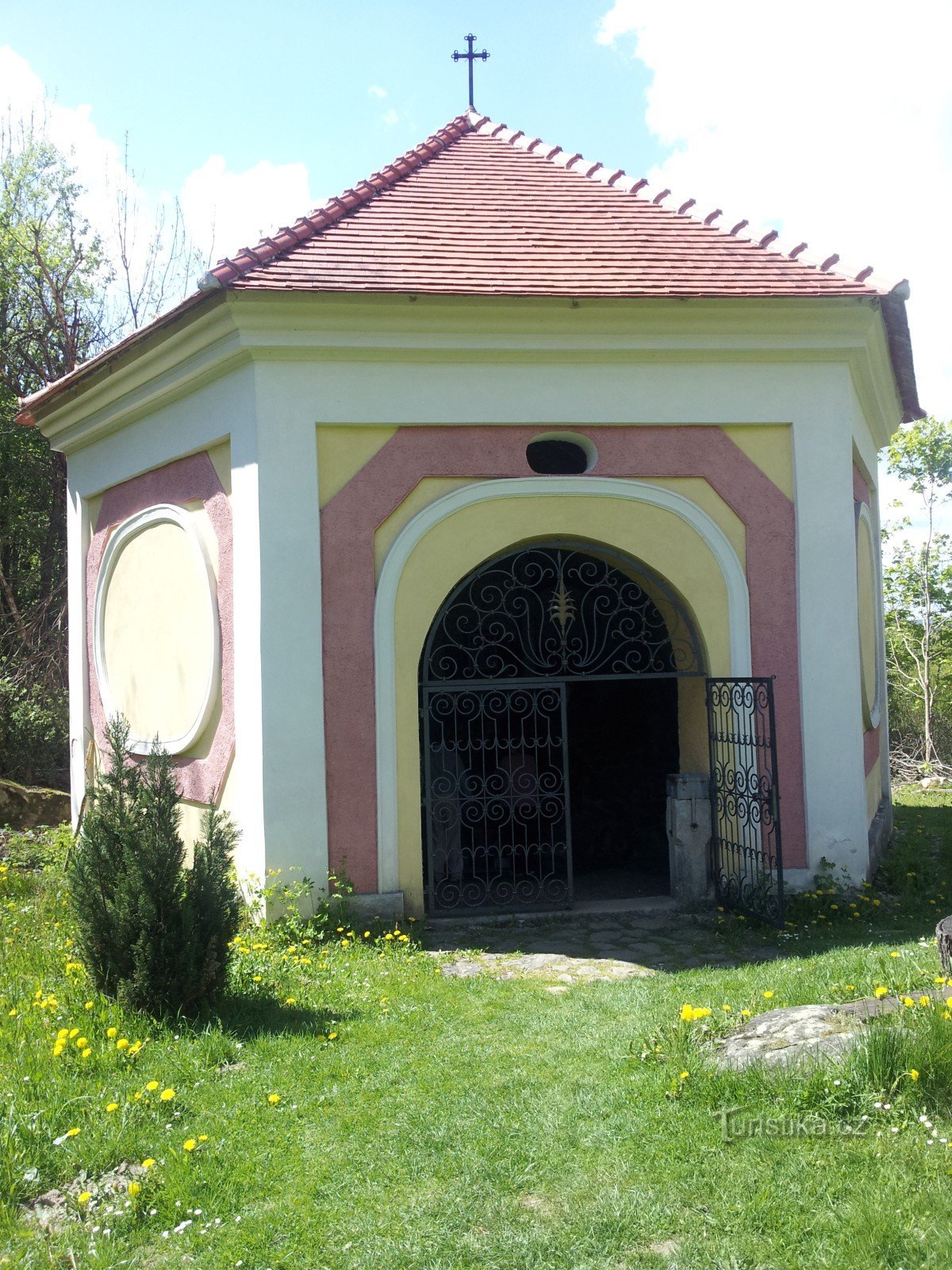 a chapel above a flowing healing spring below the church