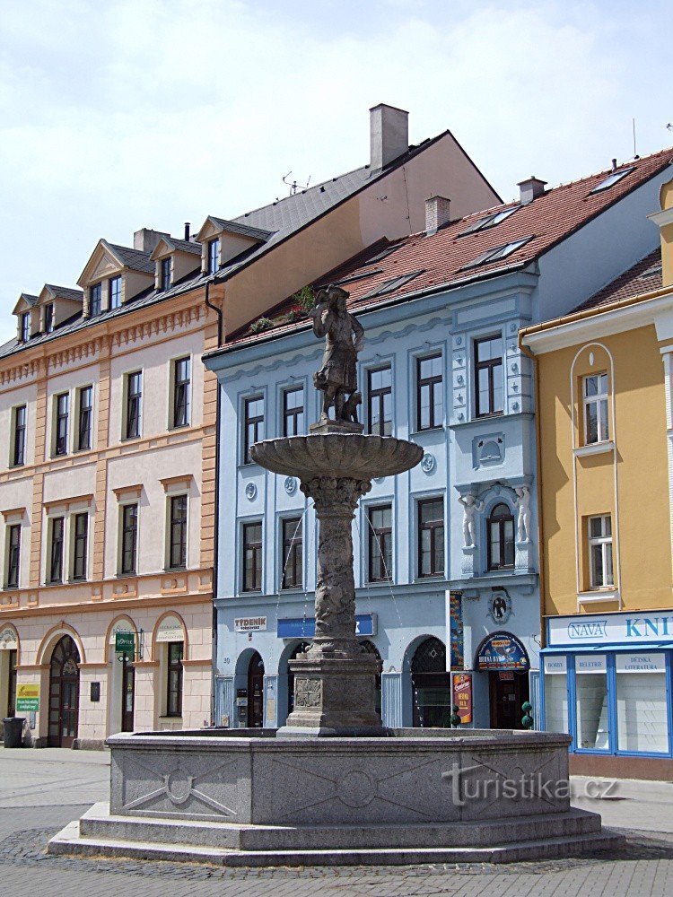 A fountain with a sculpture of a falconer