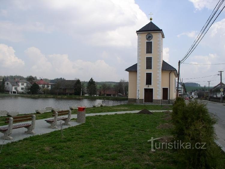 The church in the village by the pond