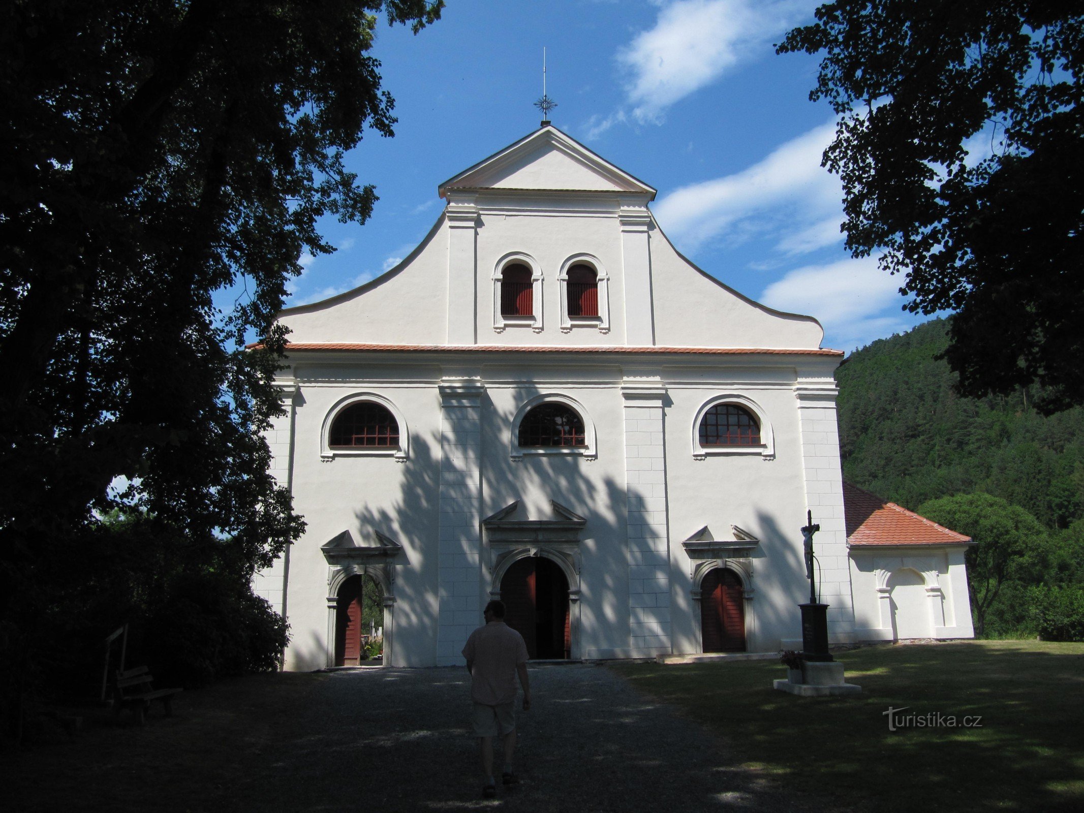 The Church of the Assumption of the Virgin Mary and the wooden bridge Černvír