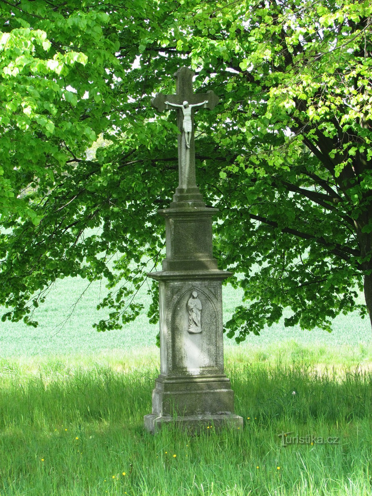 cross in front of the village