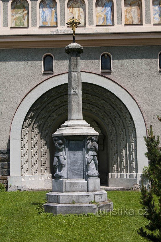 The cross in front of the entrance is also a monument to the fallen