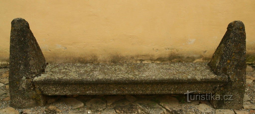 A bench in the courtyard by the church