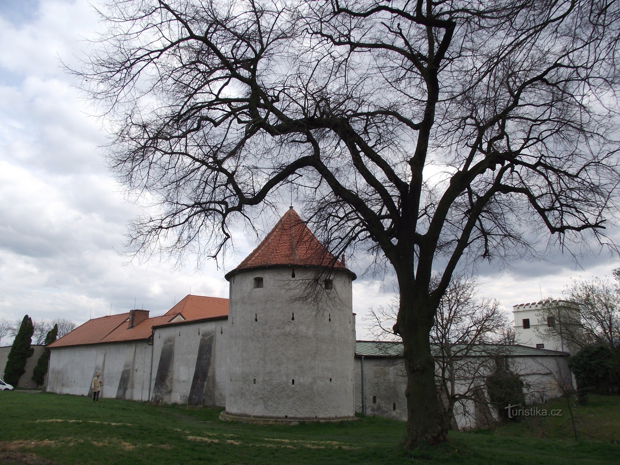 the city fortifications above the castle are attributed to the former the castle