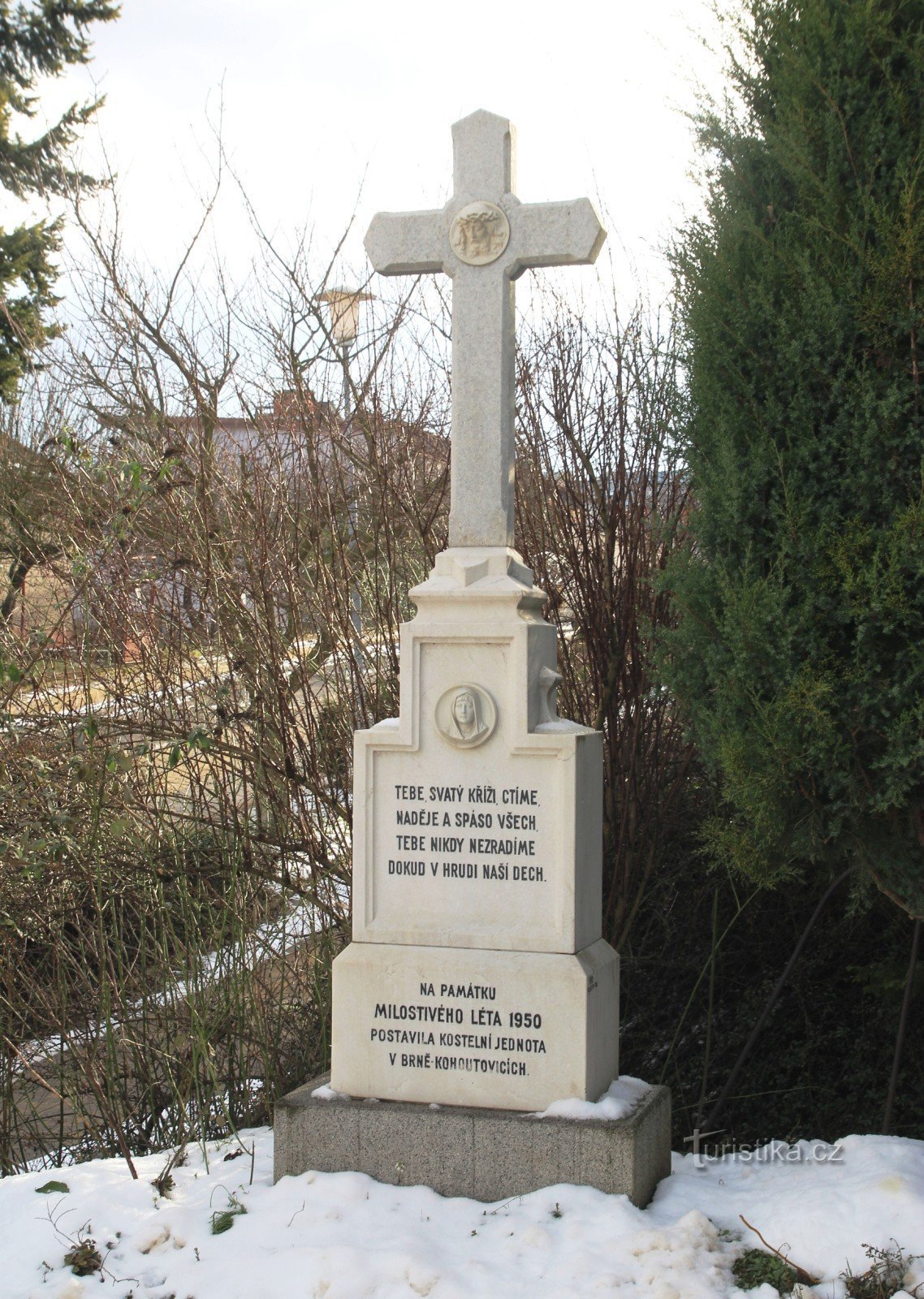 Marble cross by the chapel from 1950