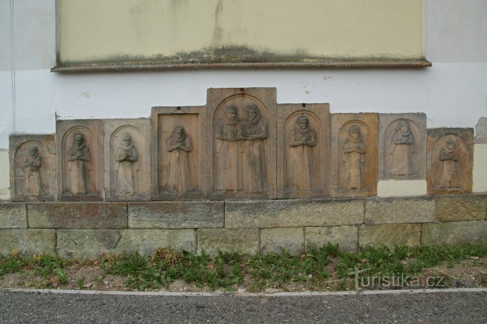 tombstones on the facade of the church
