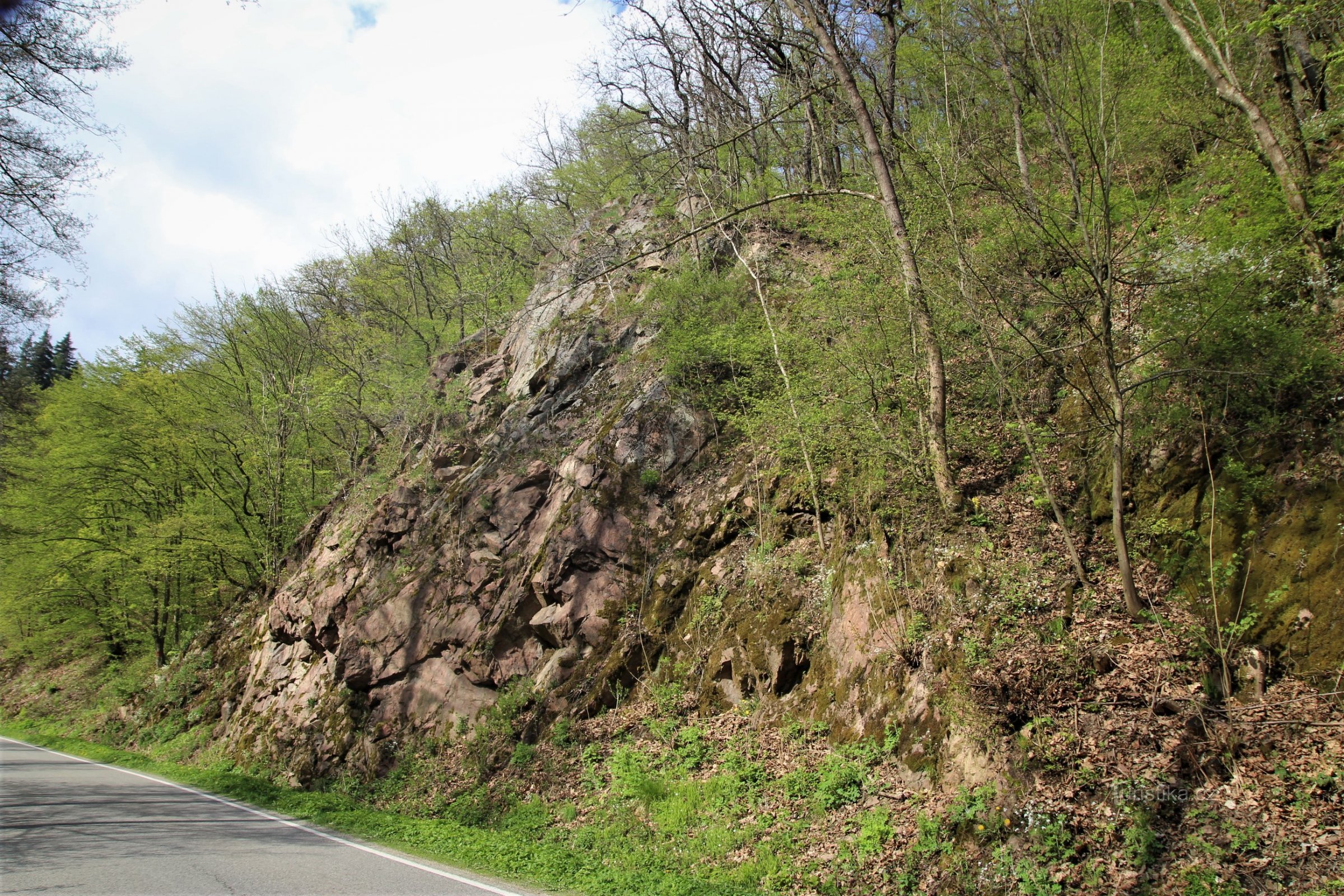 The most prominent rocky slope by the road