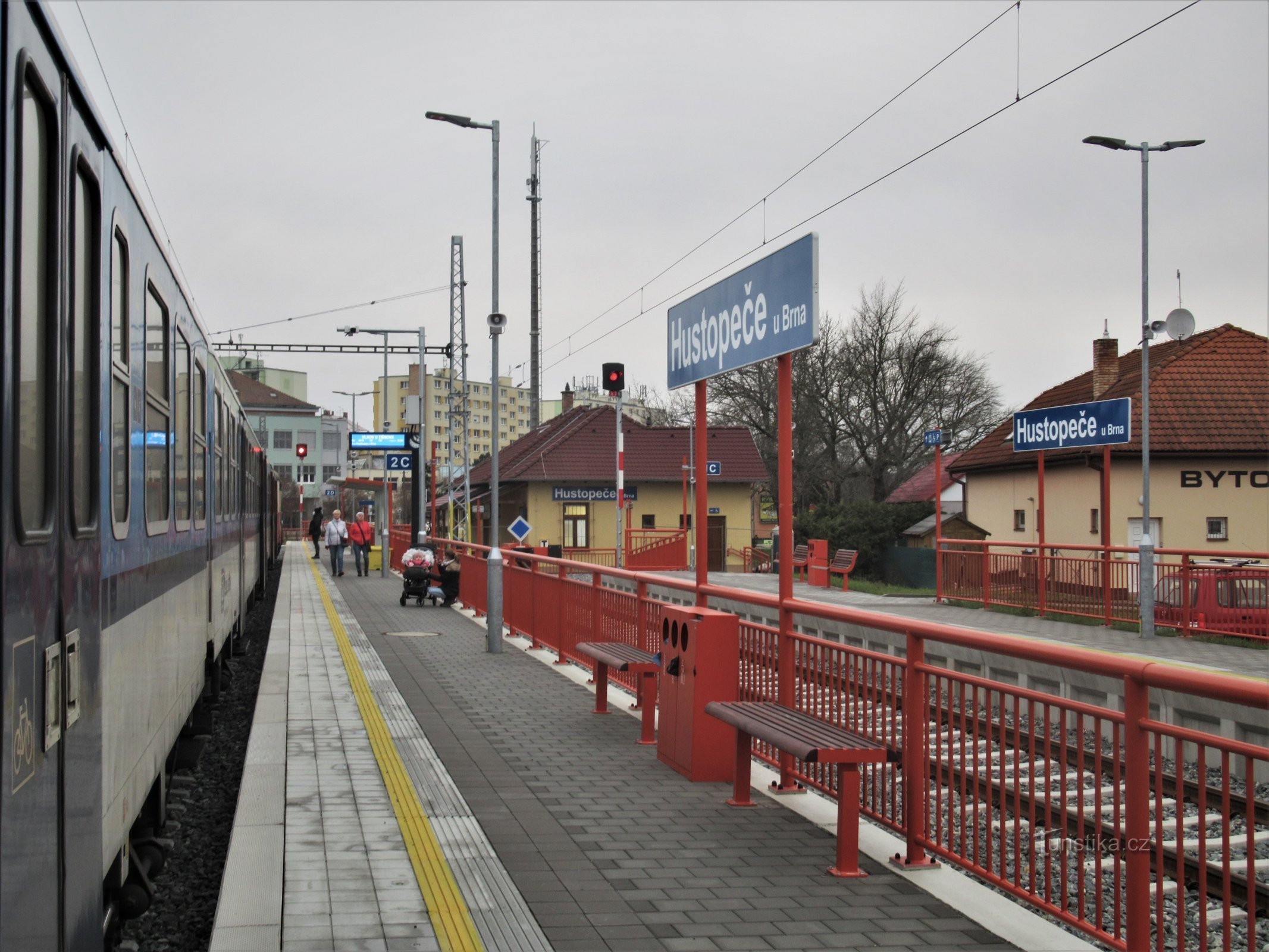 Newly opened electrified station with train arrival in December 2020
