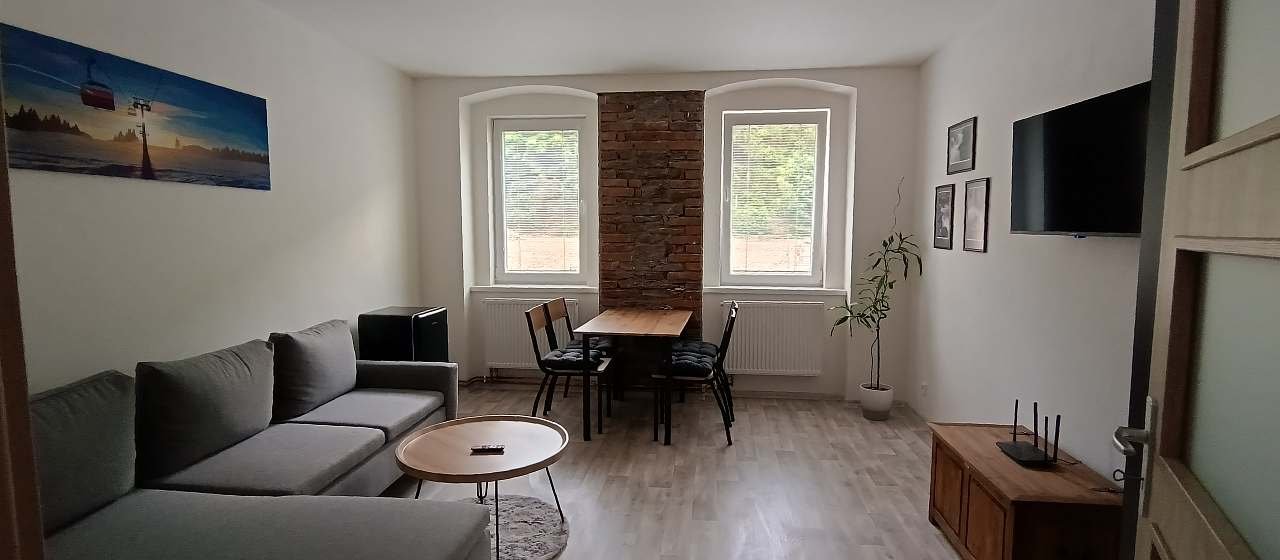 Obývací pokoj s rozkládacím gaučem