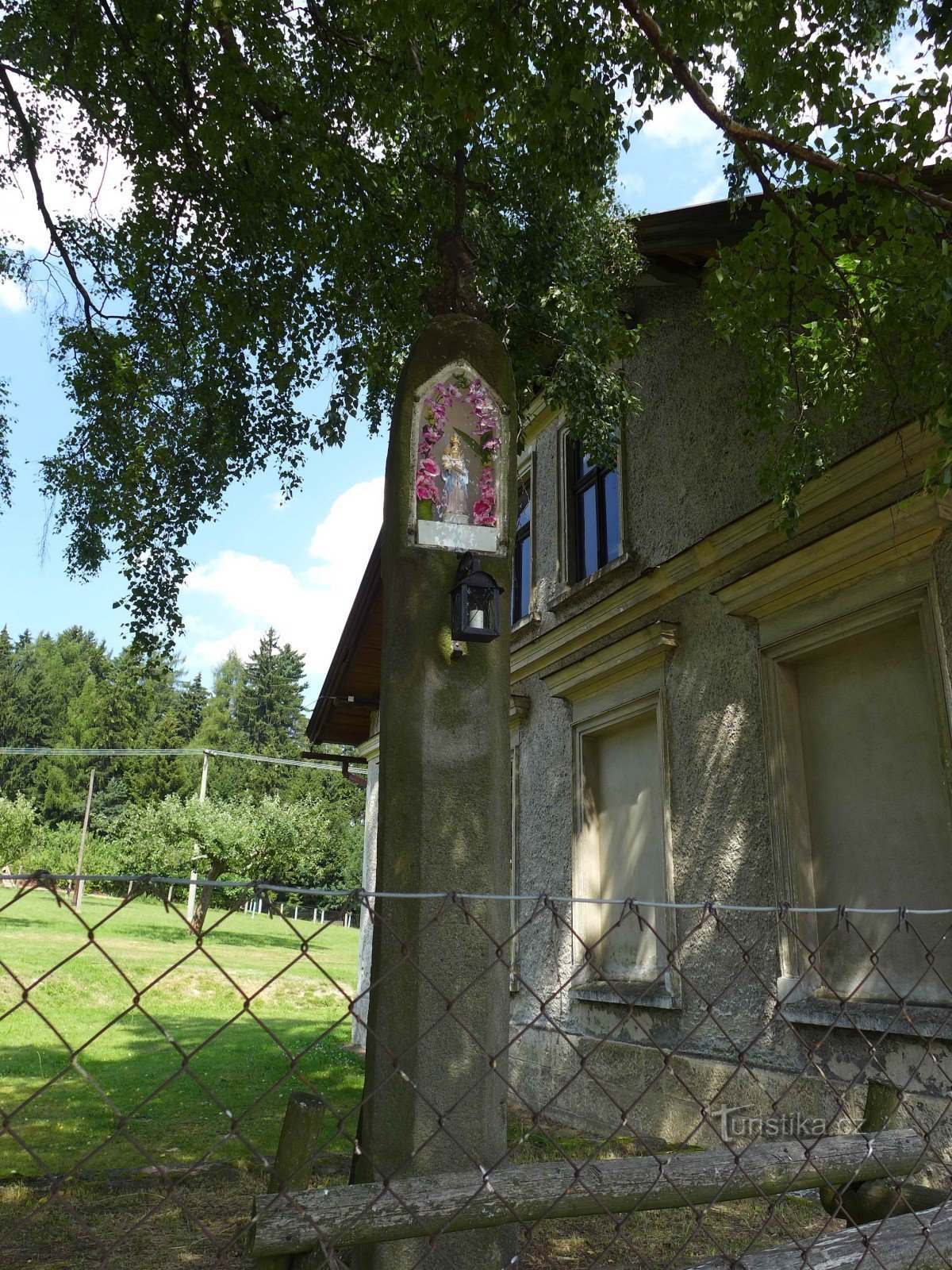 Ostaš - cross at the parking lot of the cottage settlement