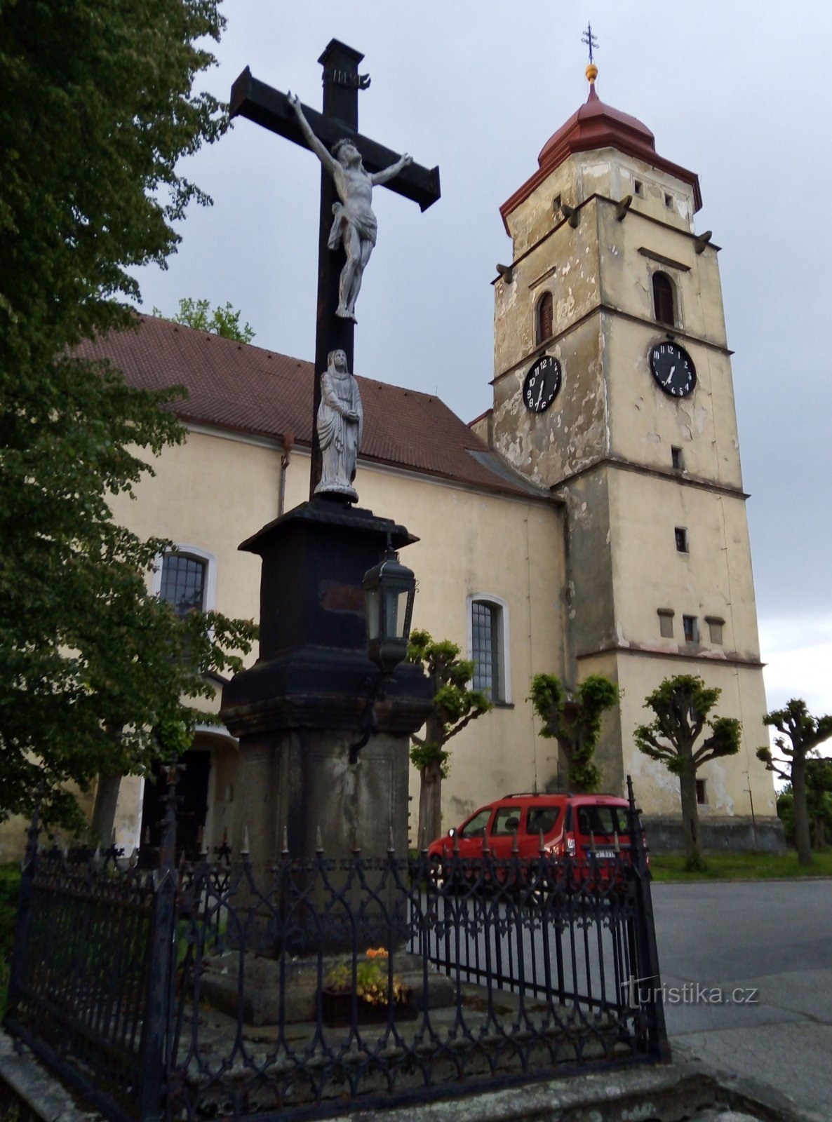 the church and the cross in front of it are listed