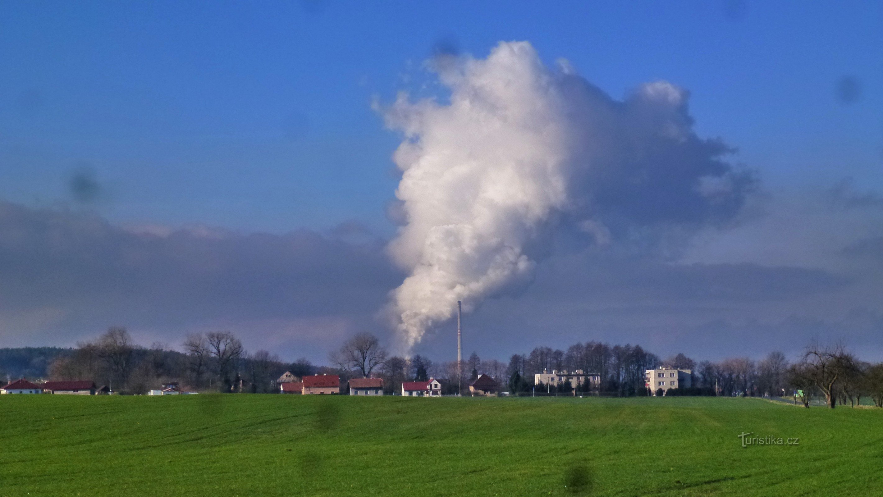 view of the village from the direction of Brloh (everyday picture with the background of the Chvaletic power plant)