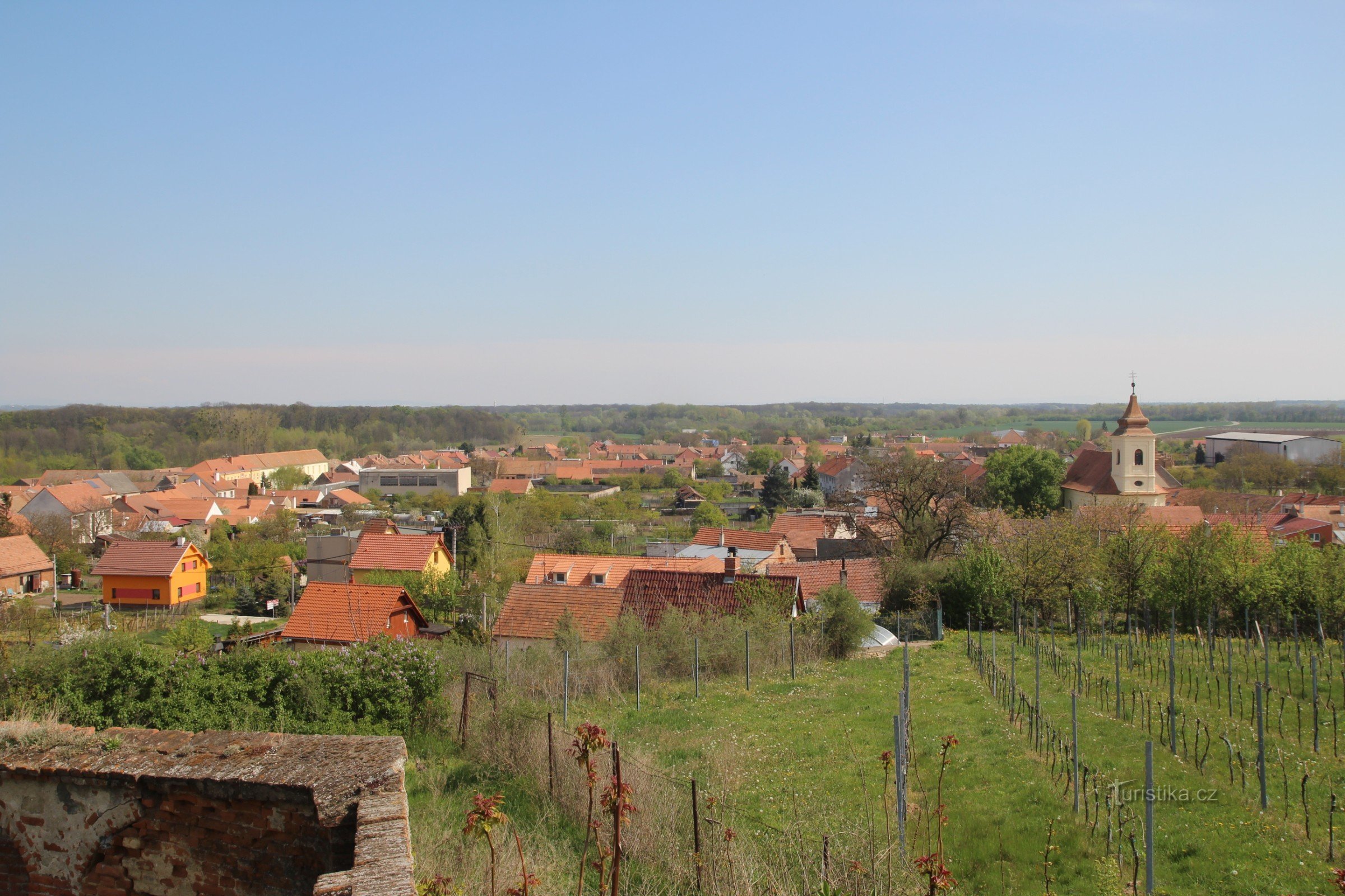 View from the cemetery wall to the village and floodplain forest