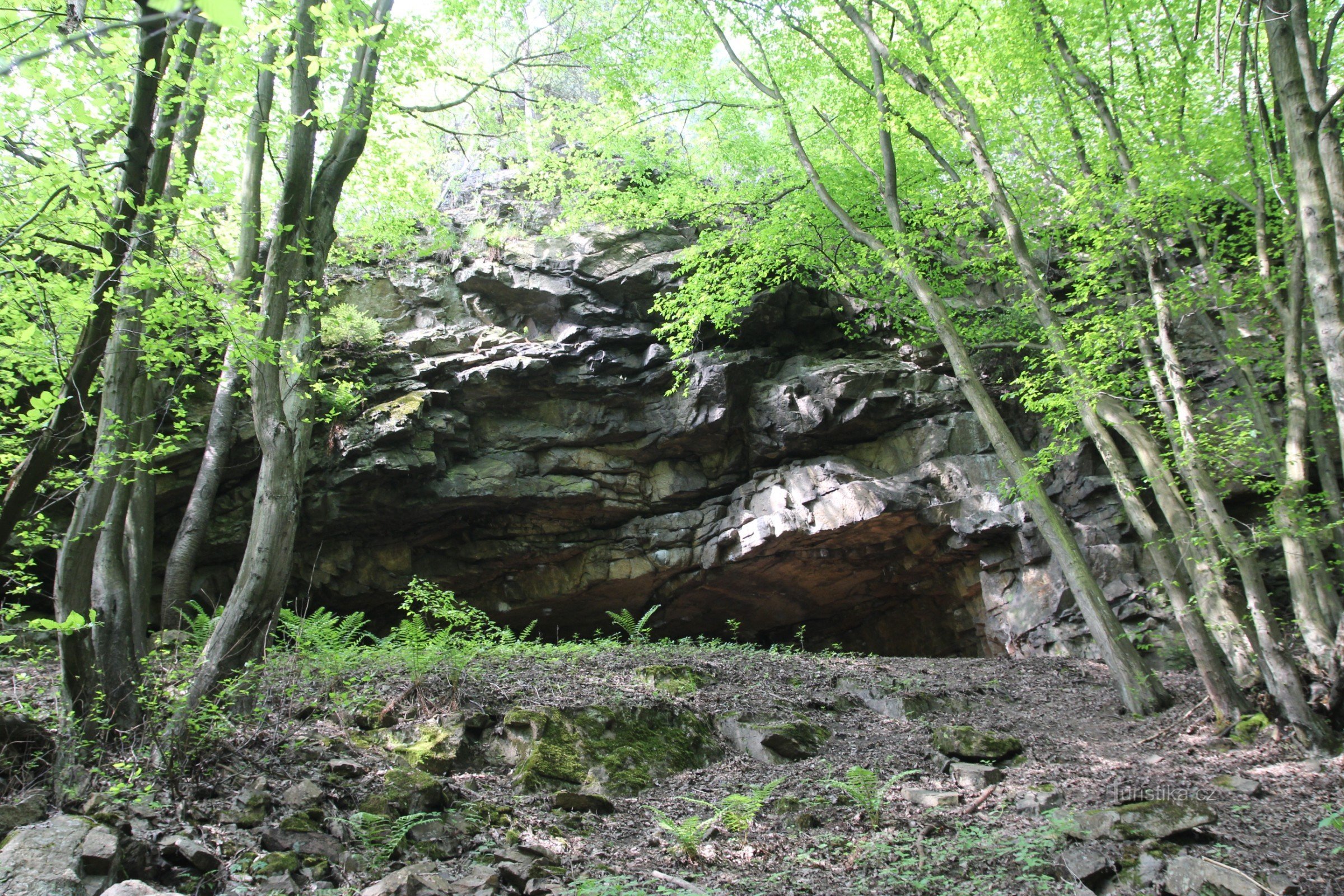 View from the valley slope to the cave