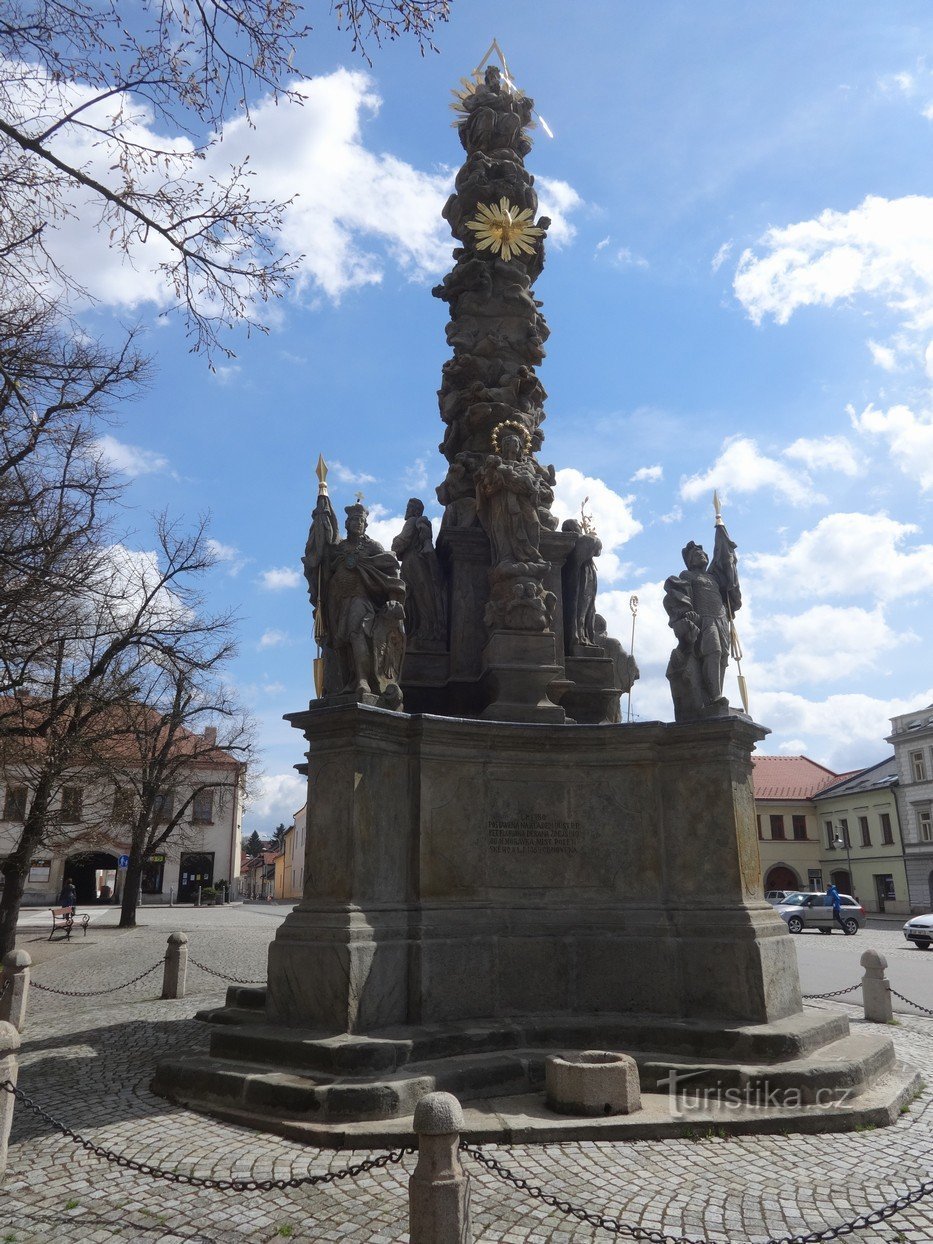 Field and baroque column of the Holy Trinity