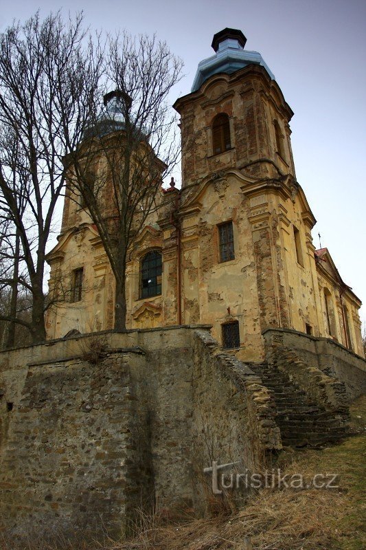 Dilapidated access staircase. Against the original plans, the church received a massive d