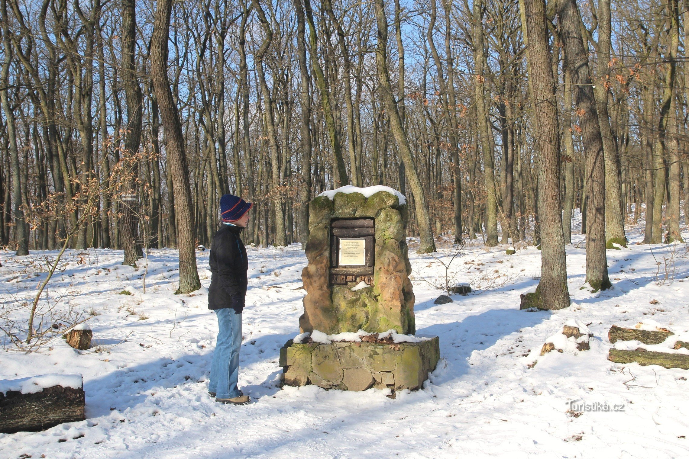 The monument to František Bašný is located at the tourist crossroads