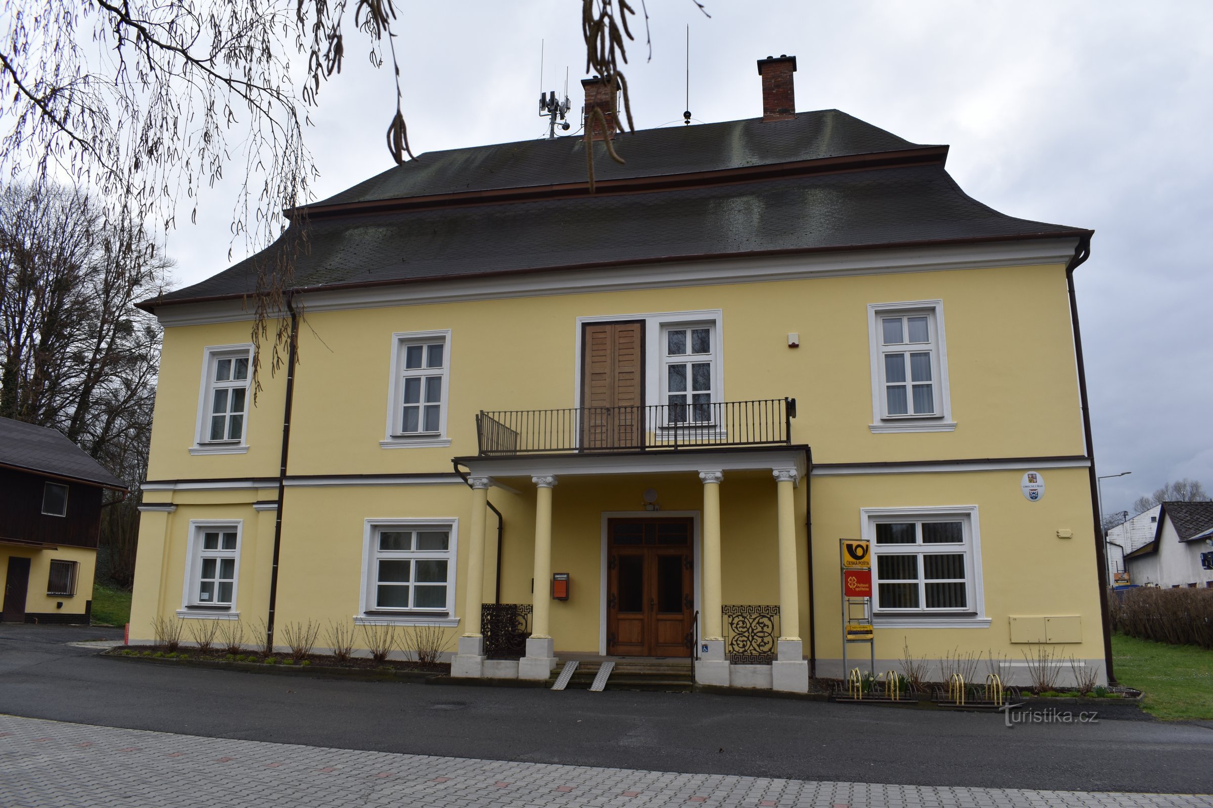 the facade of the castle with an entrance and a balcony