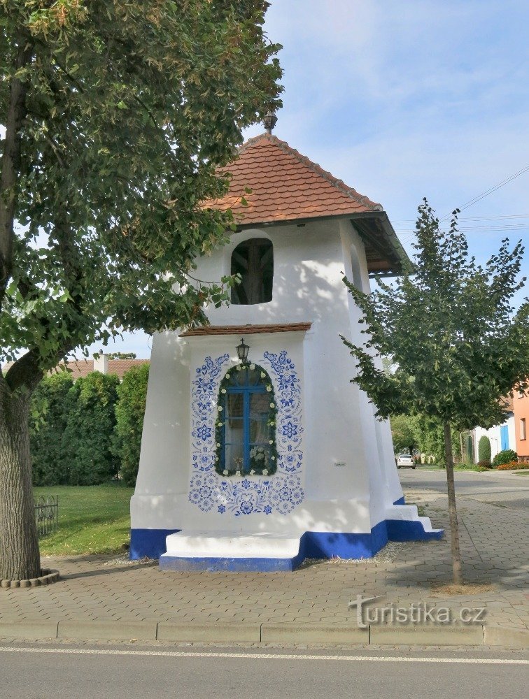 facade of the bell tower with a chapel