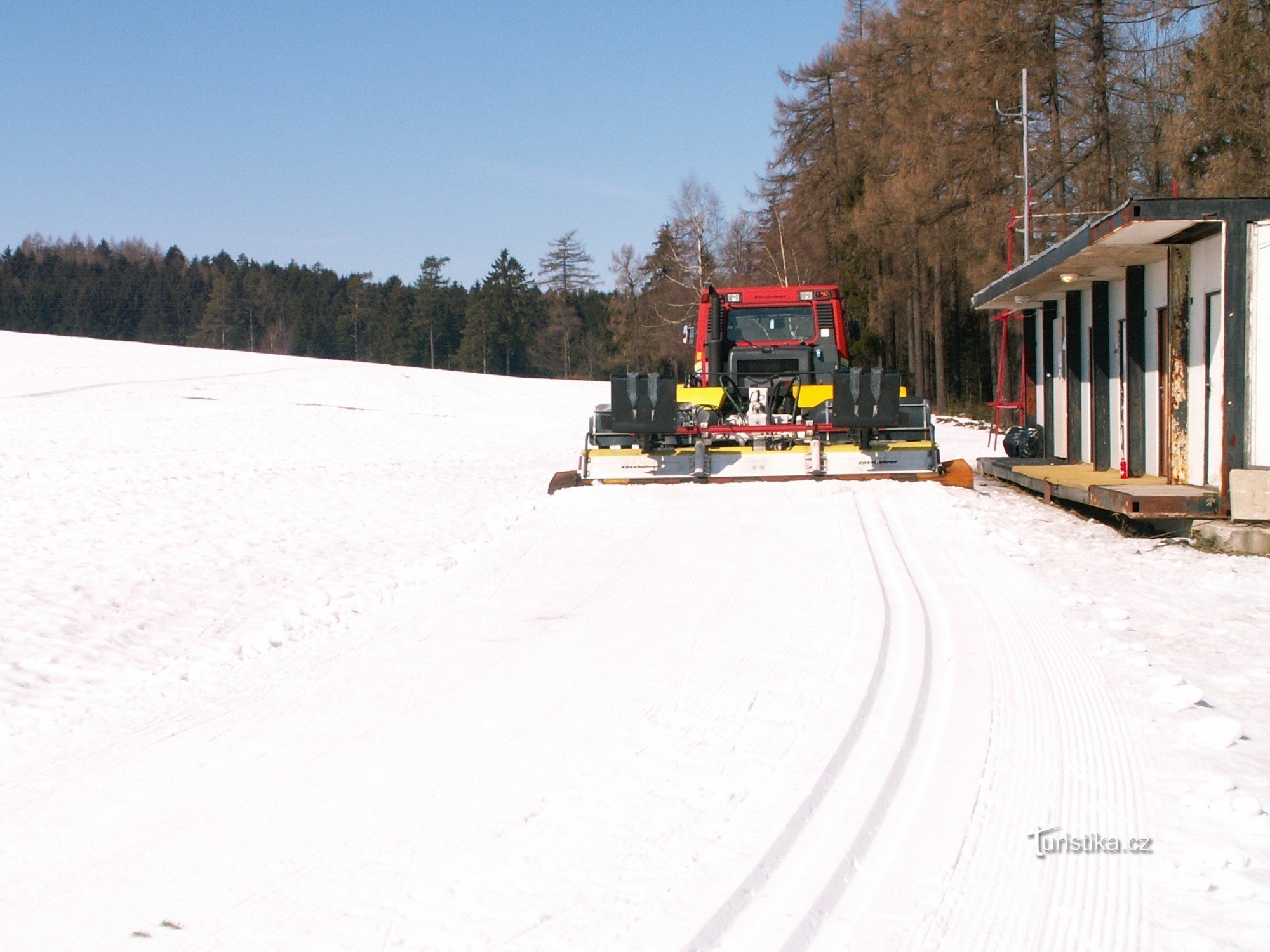 Snowmobile for track maintenance