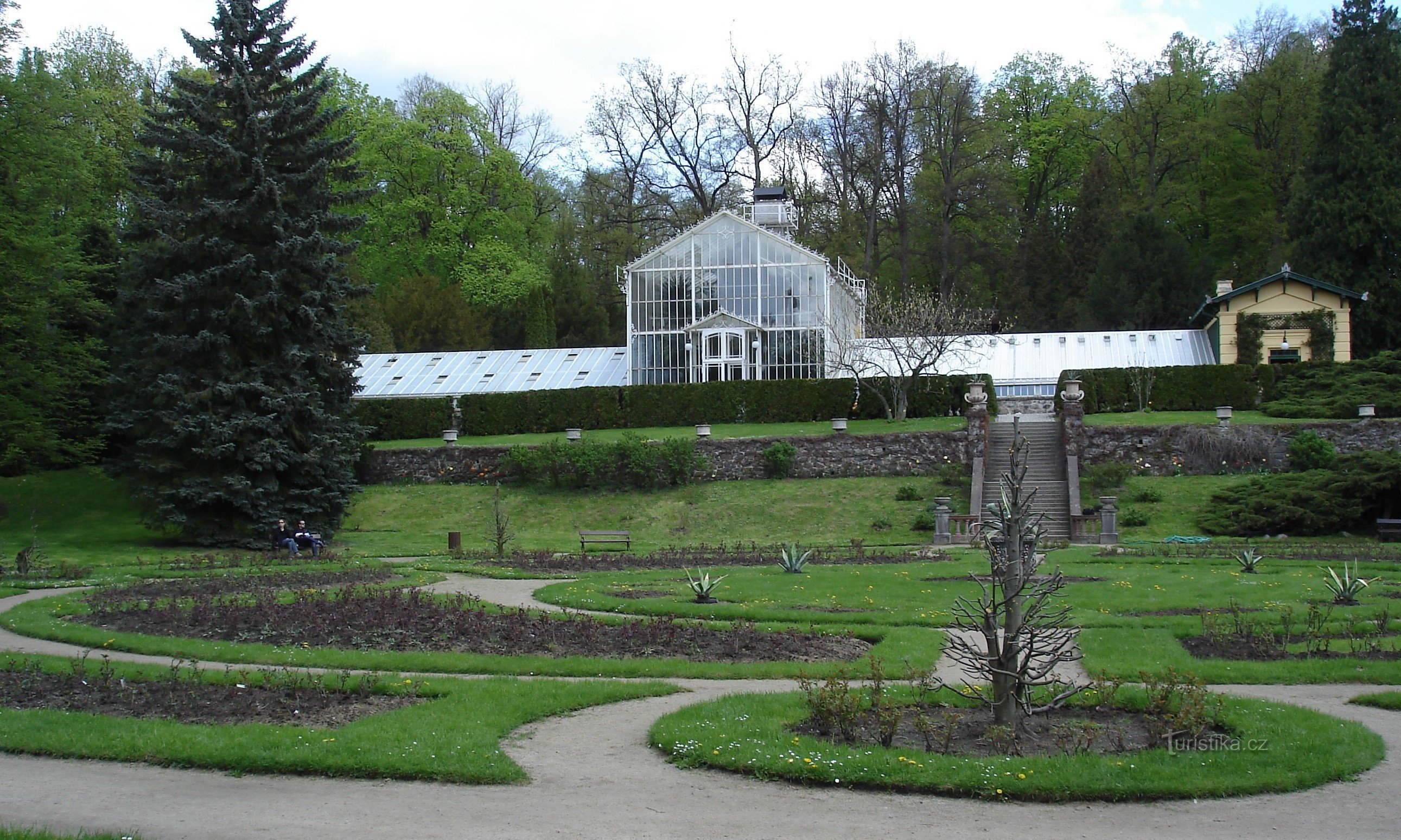 rose garden with greenhouse