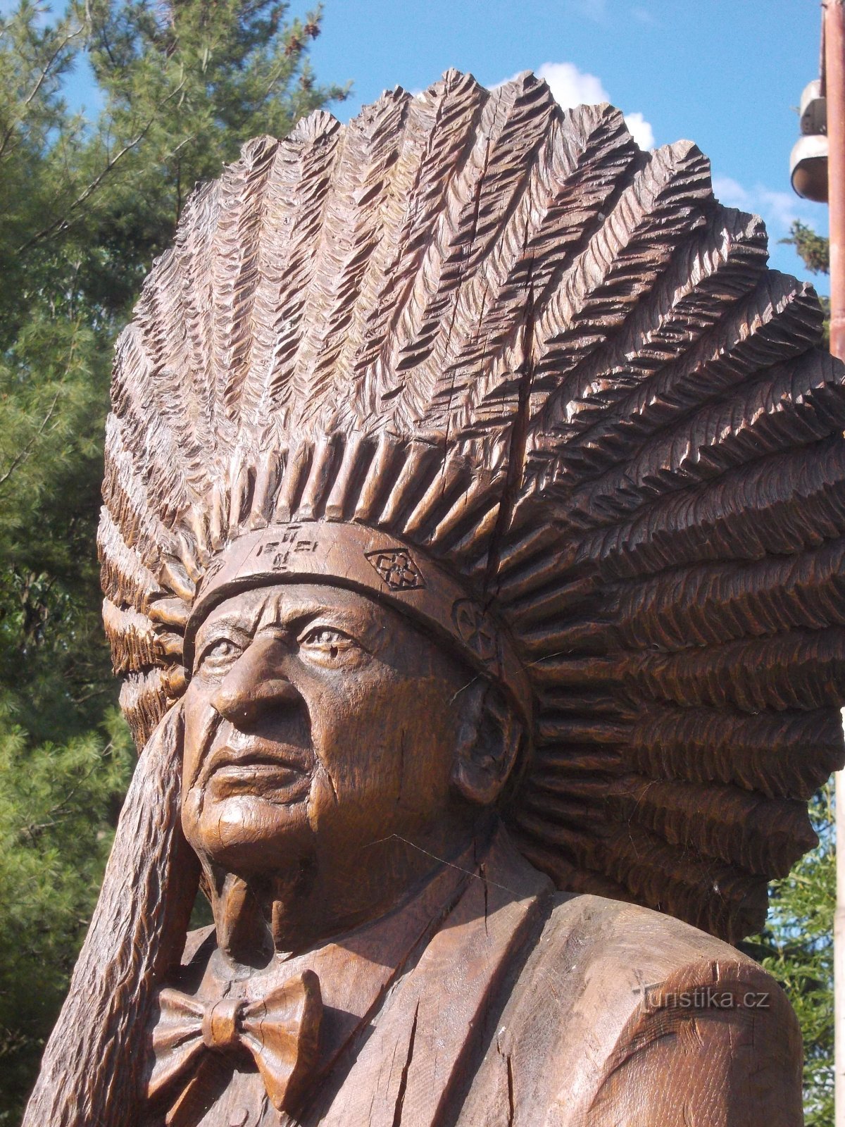 with the headdress of the honorary chief of the Kickapoo Indian tribe