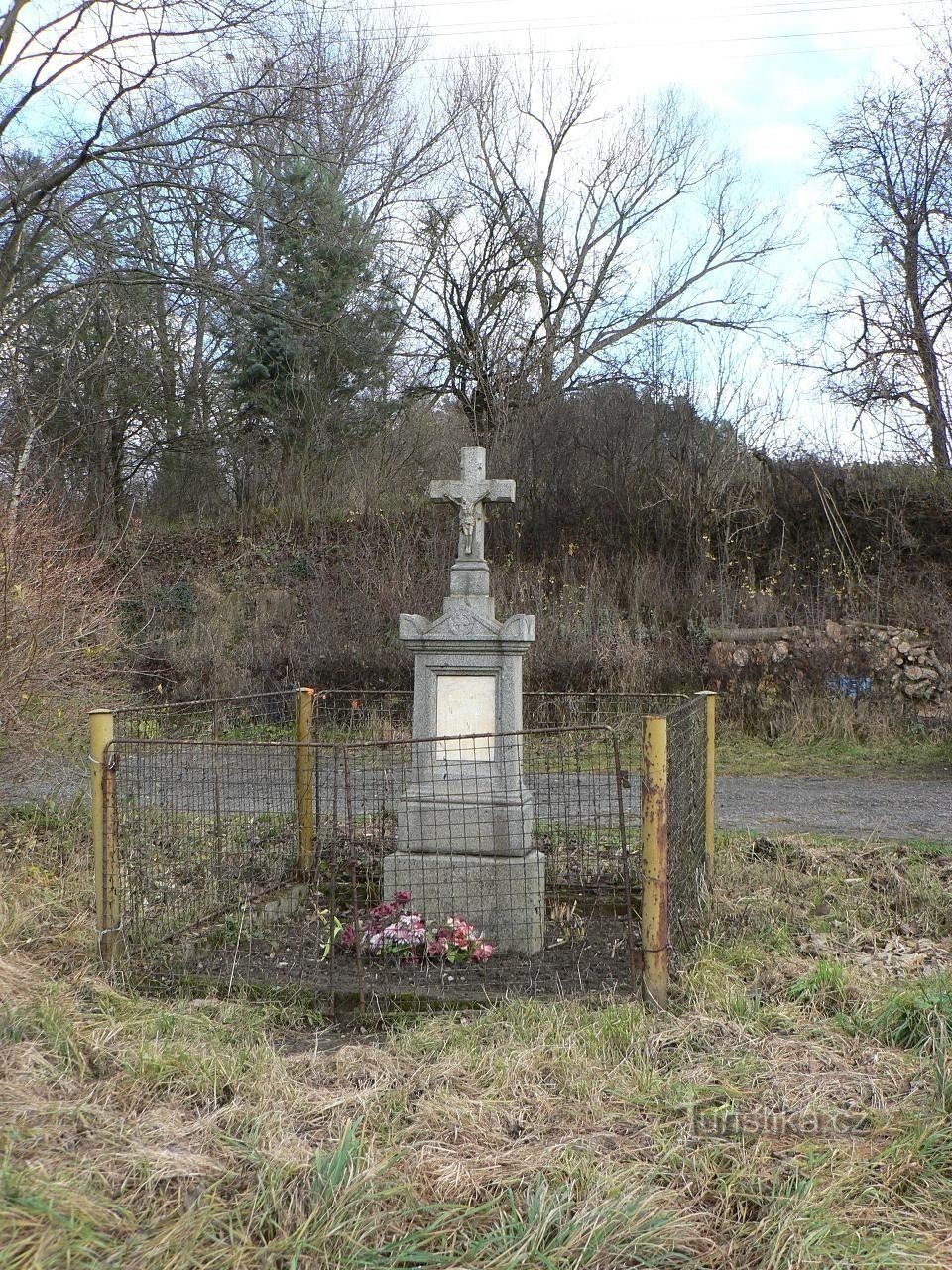 Saddle, a cross on the edge of the village