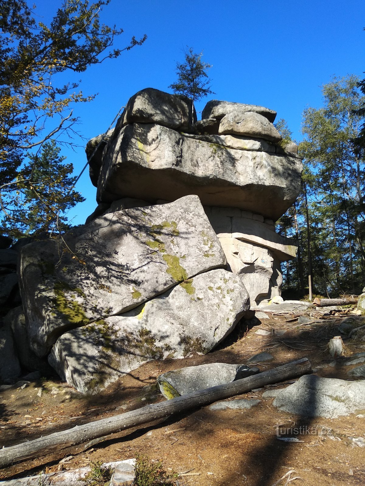 a rock with a ladder on the southwest side of Mount Luč