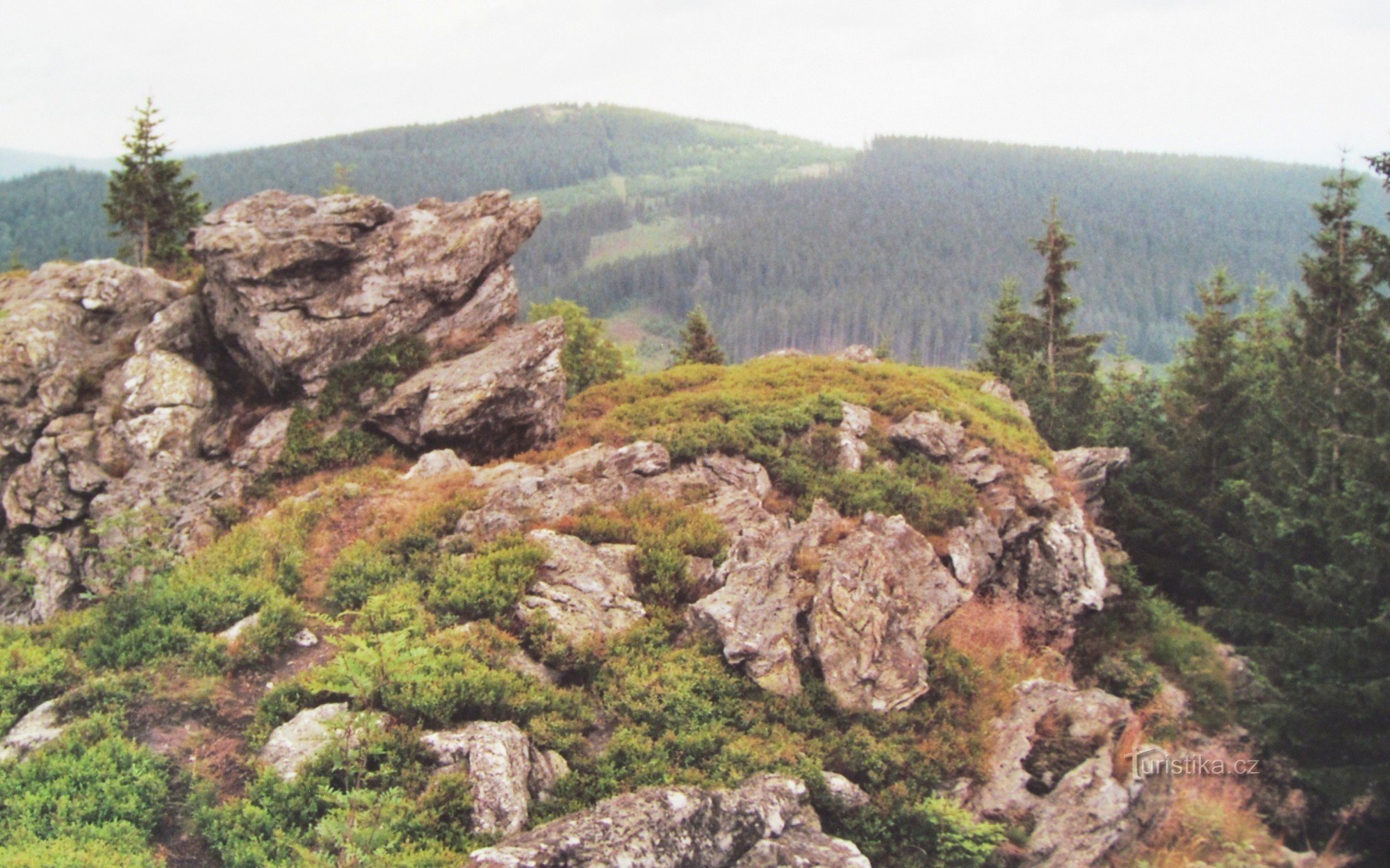 Rocks at the top and a view of Žárový vrch