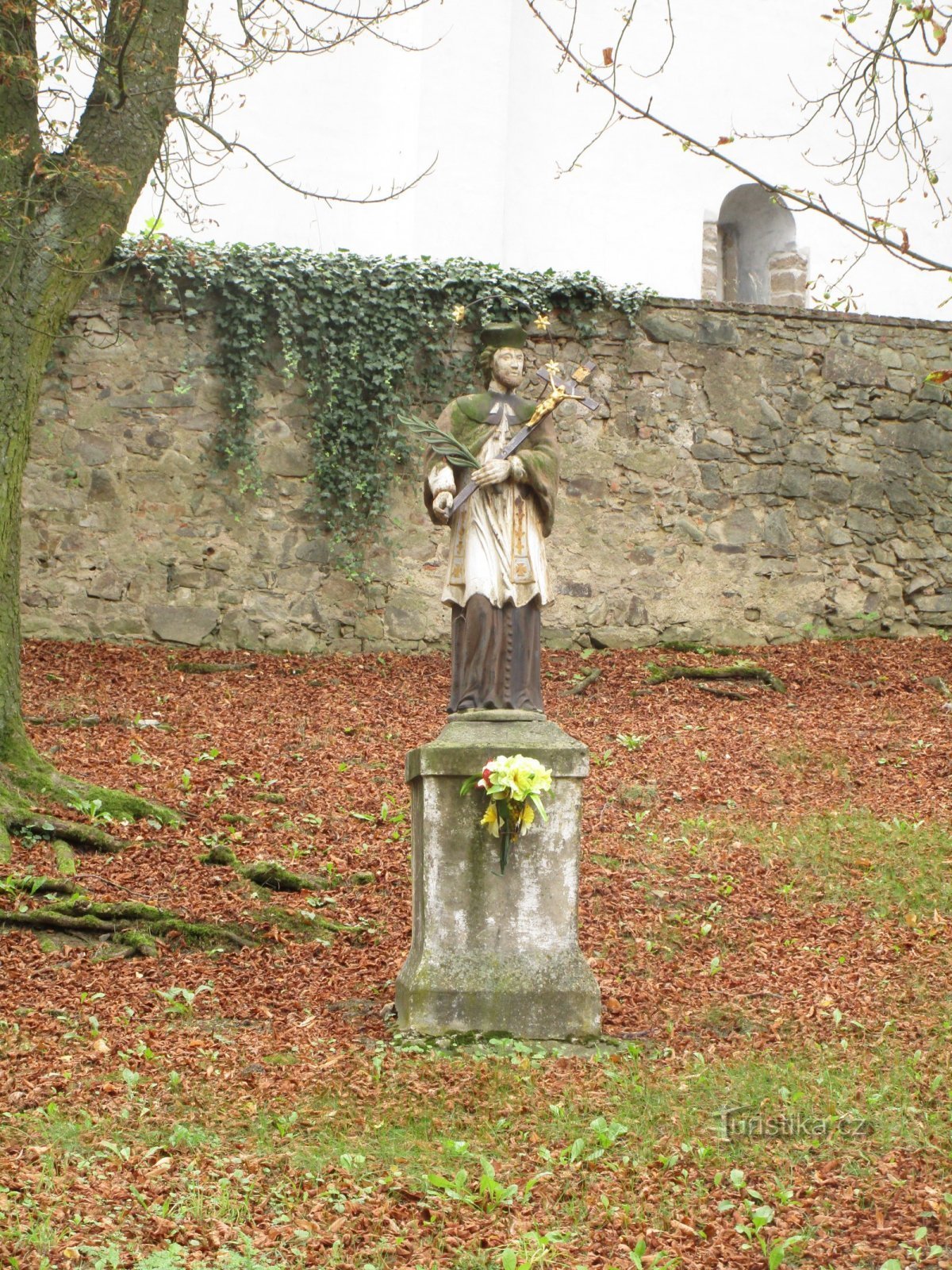 statue of St. John of Nepomuck in front of the church