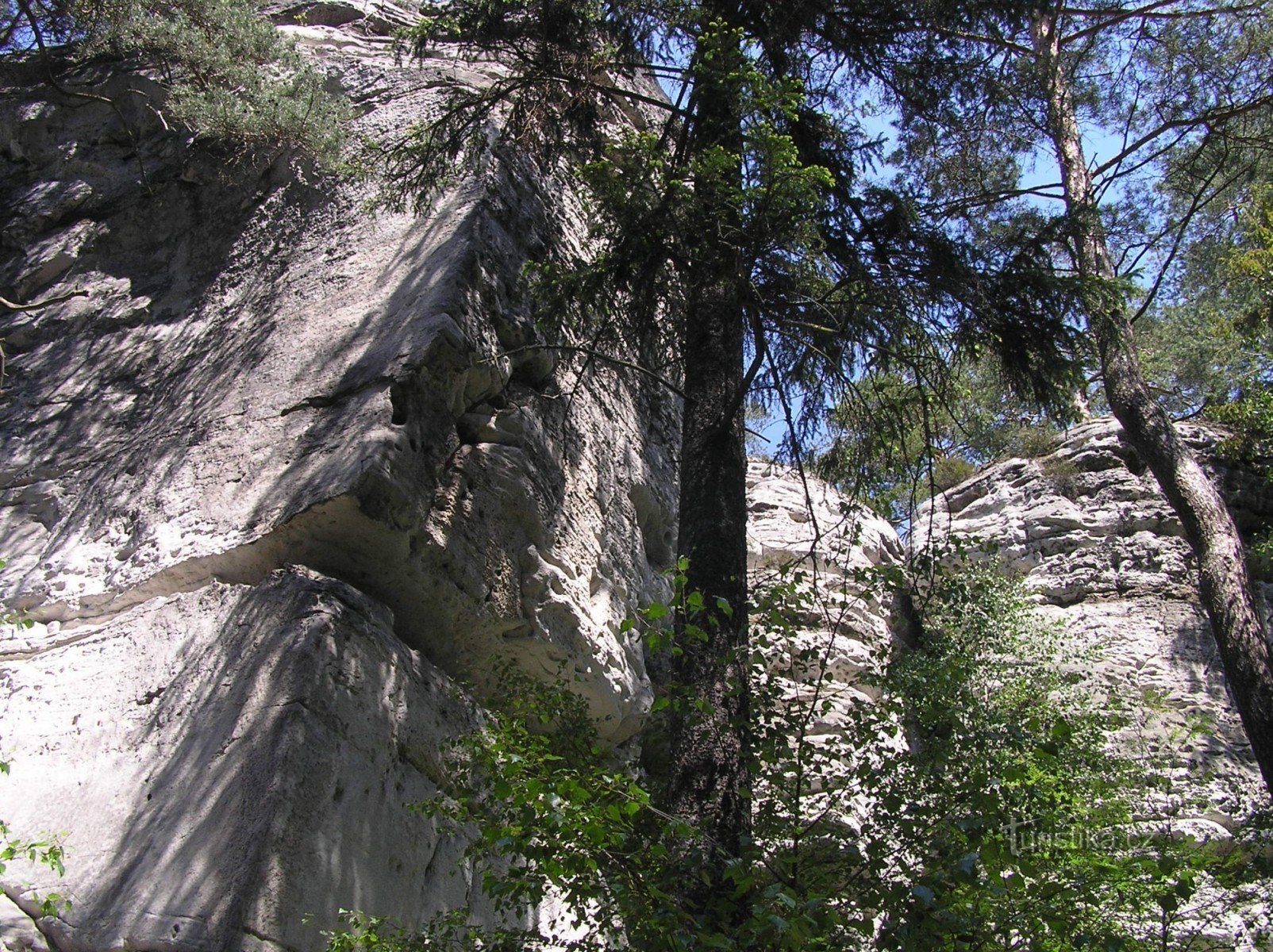 the walls of the Devil's hand from the blue tourist sign below the Janová lookout