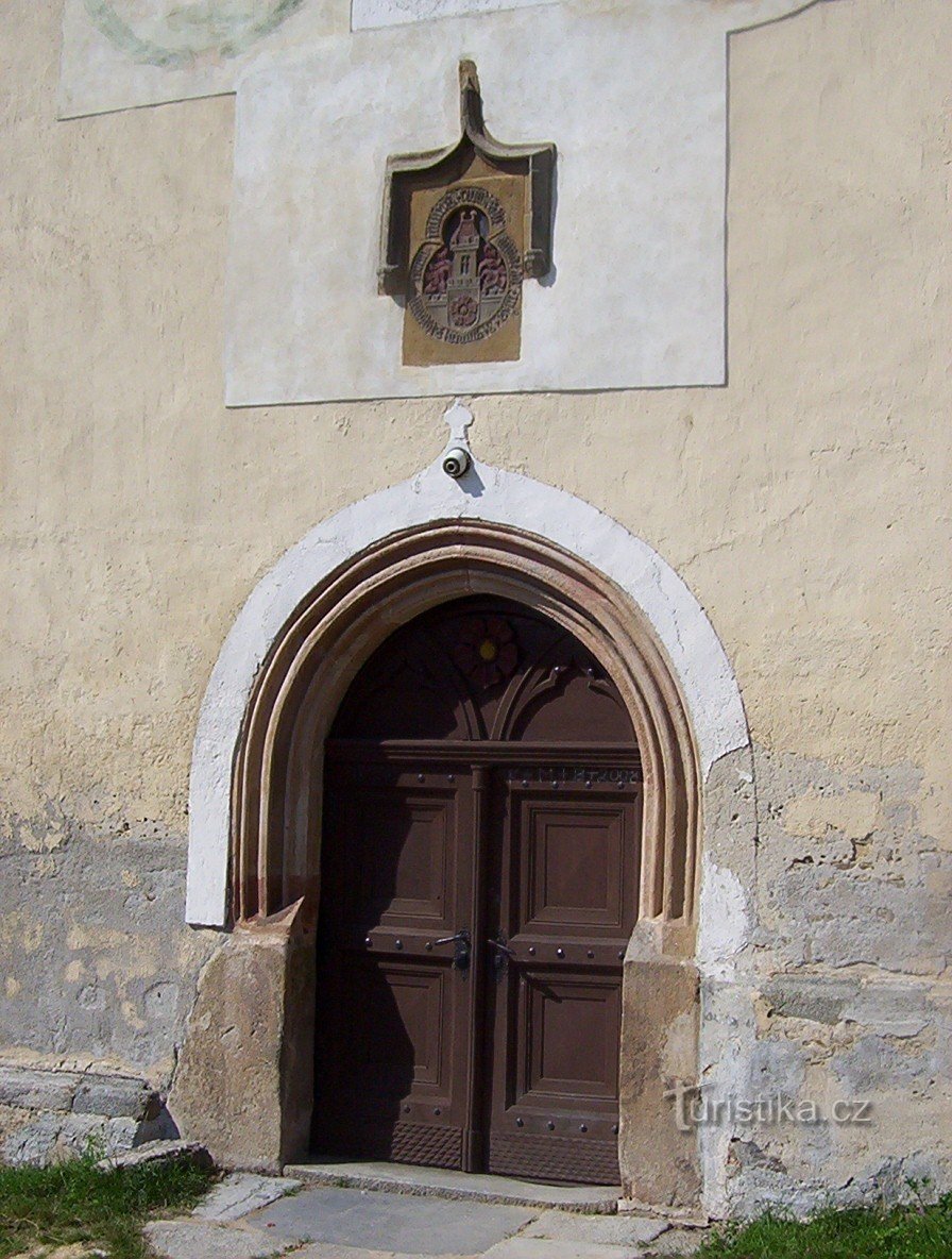 Trhové Sviny-Church of the Assumption of the Virgin Mary-town coat of arms above the portal from 1485-