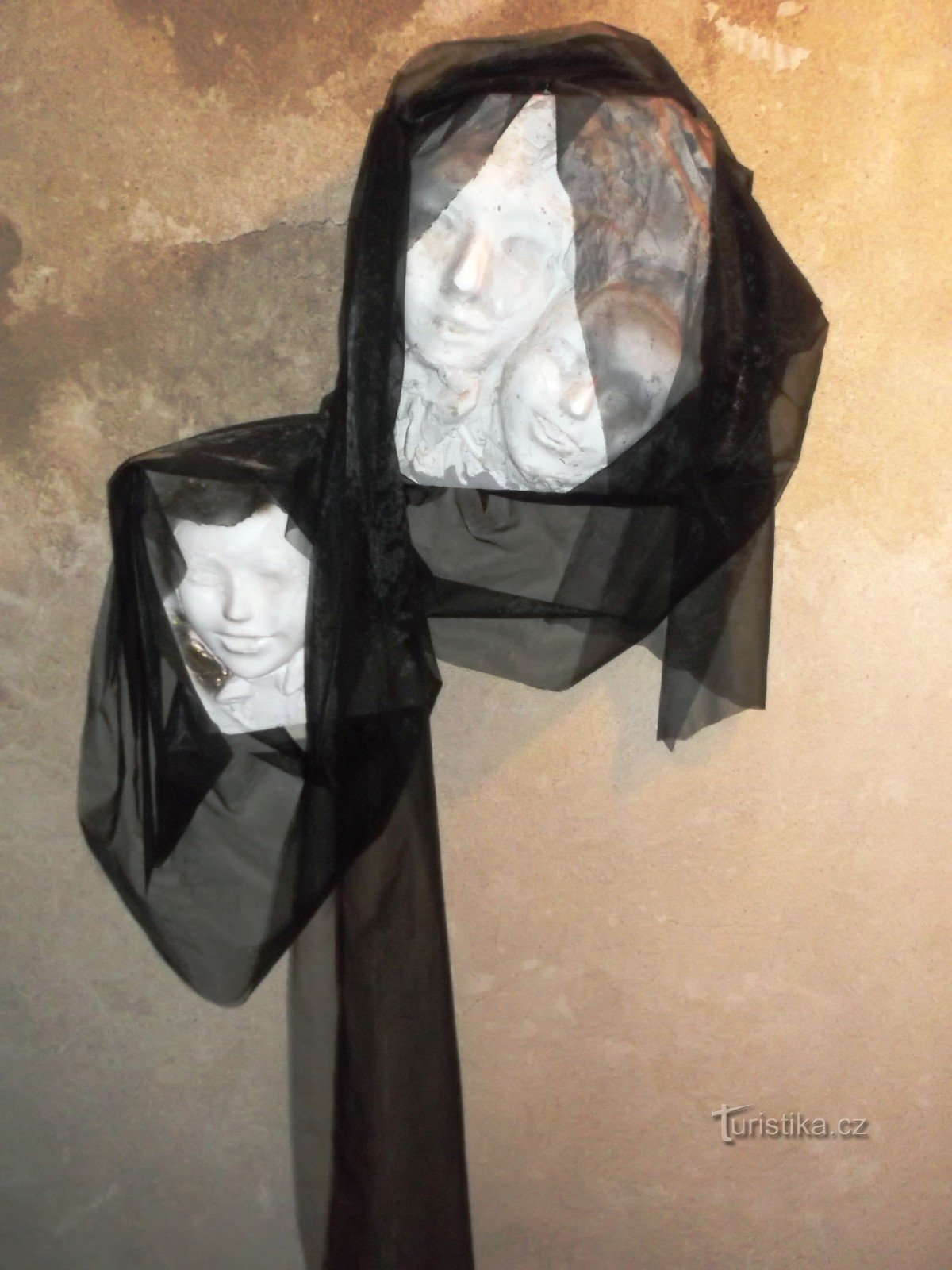 Faces in a black veil