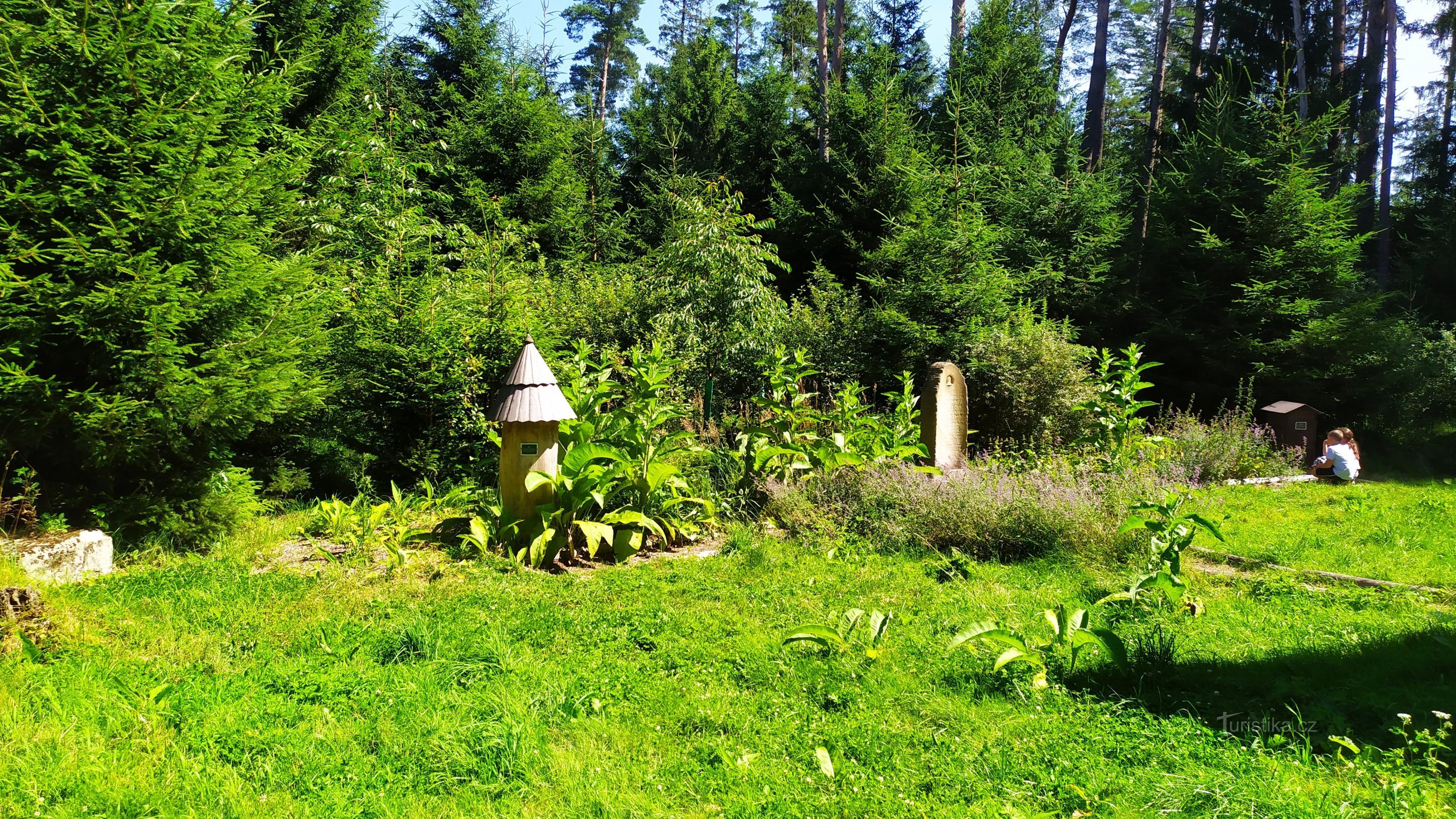 beehives with the original stone monument