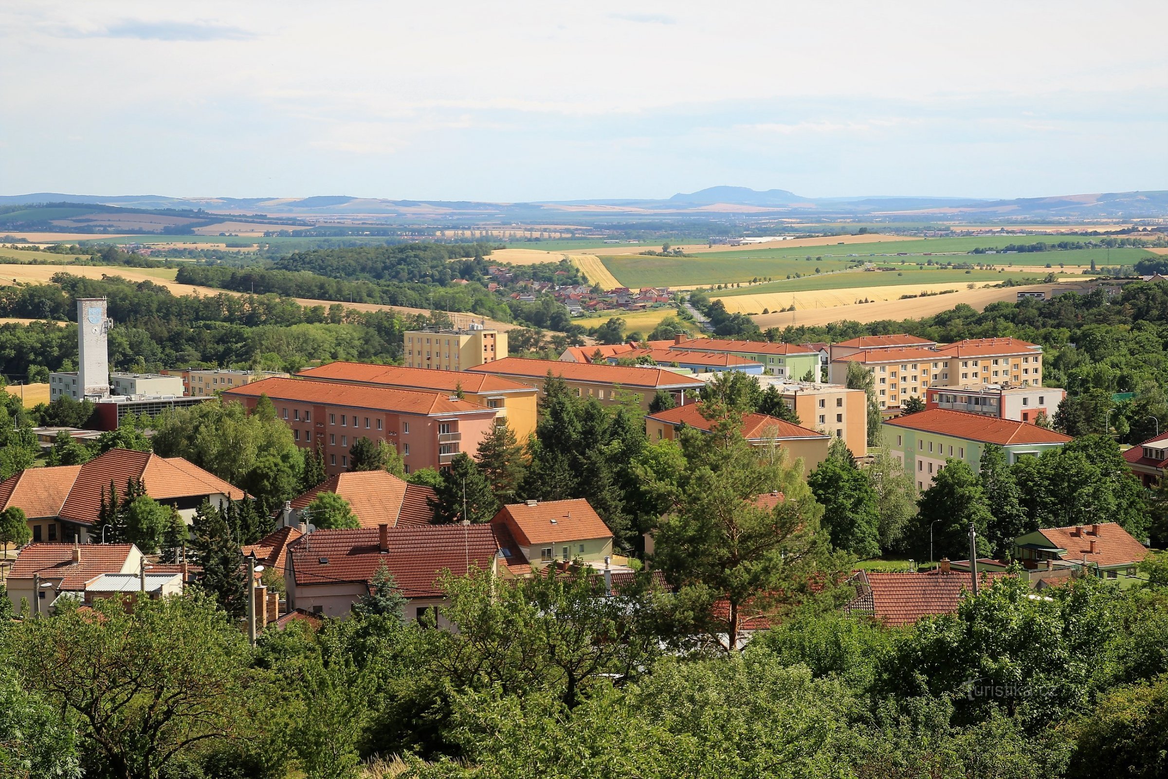 In the foreground is the housing estate in Mokré, behind it the South Moravian plains and on the horizon