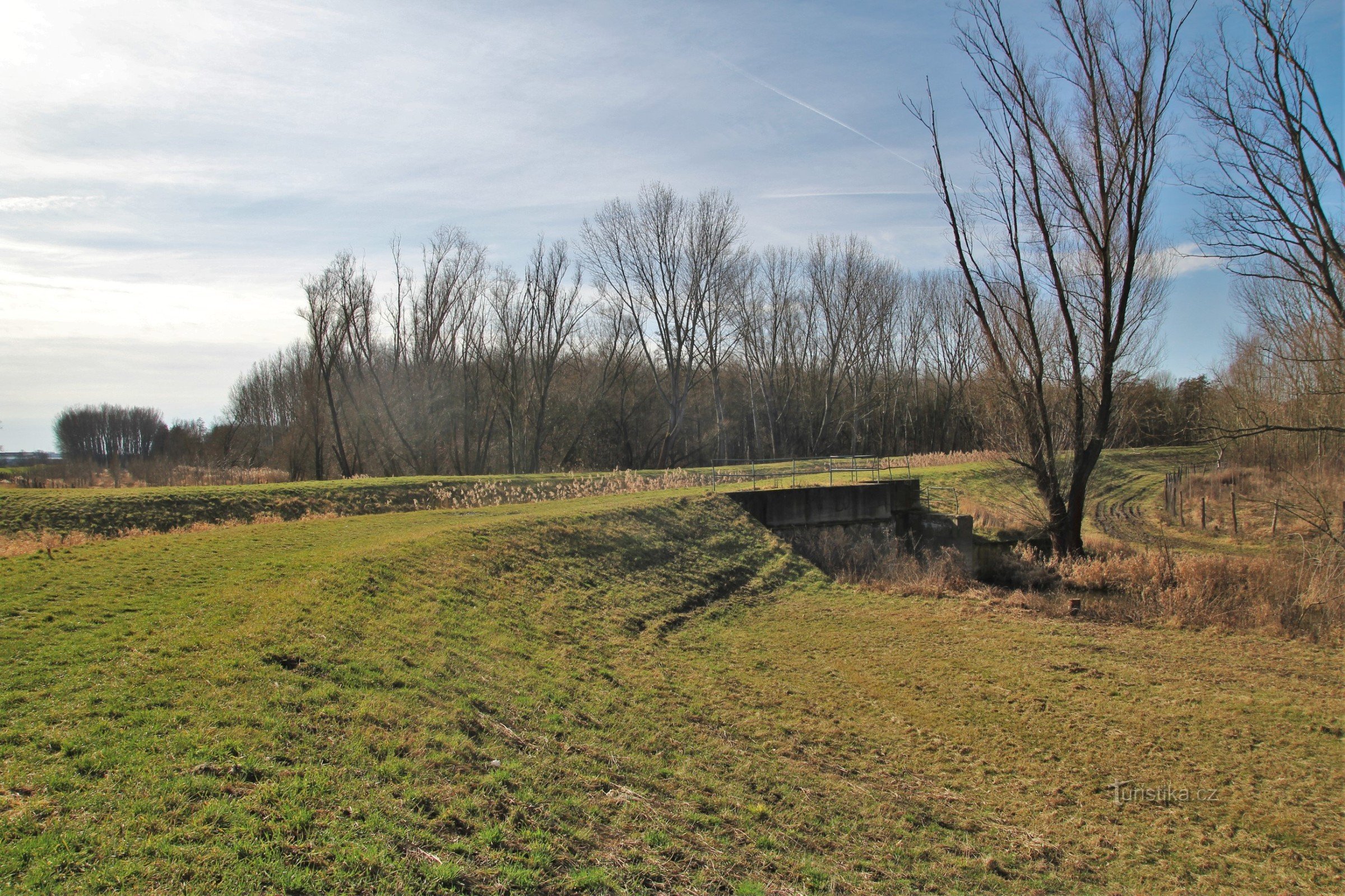 Litobratřický stream flowing in an artificial bed and a drainage channel flowing below it