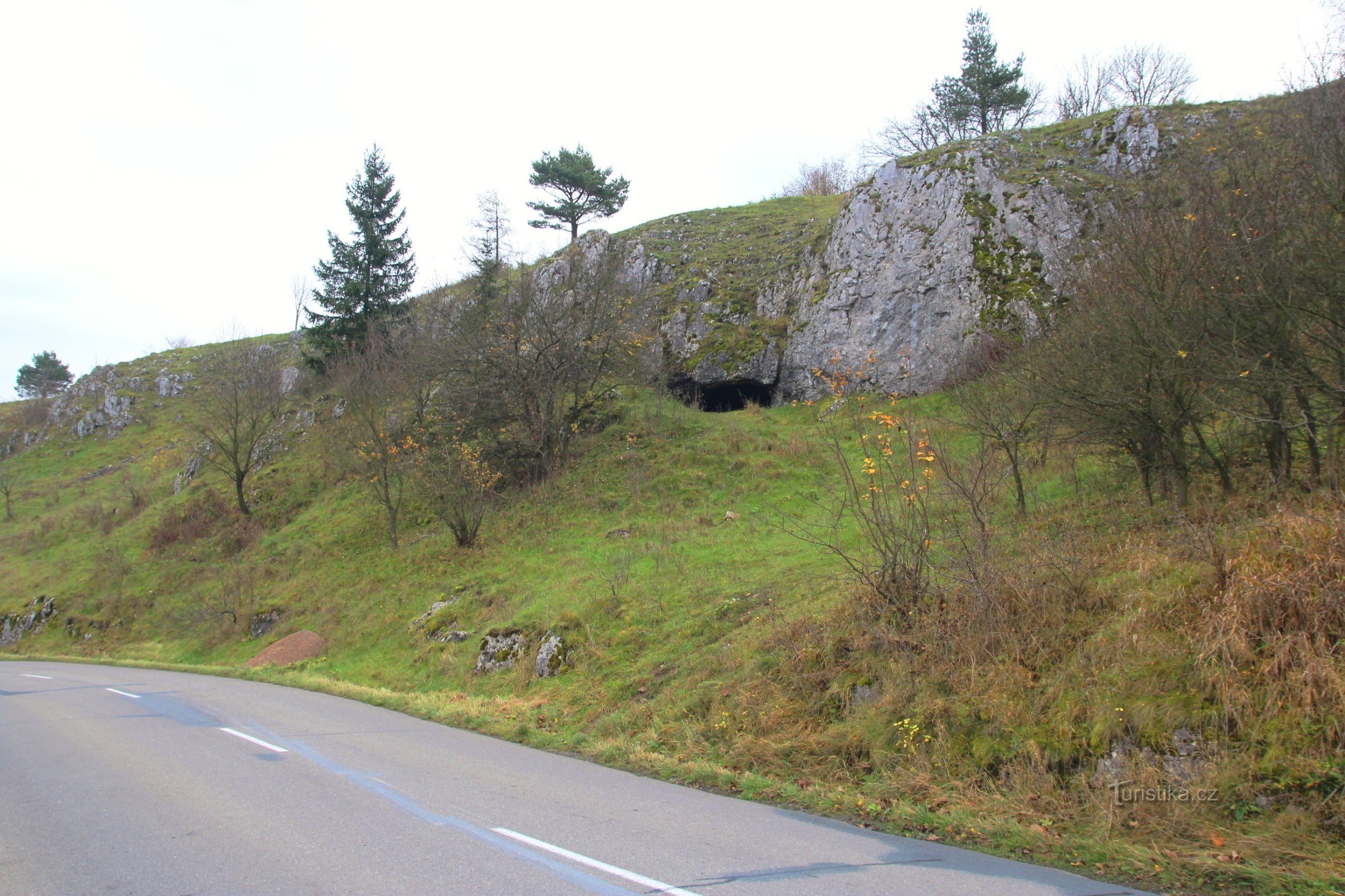 The cave entrance is easily visible from the road
