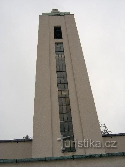 Church tower: The building is dominated by a 30 m high tower, which is topped by a two-armed cross