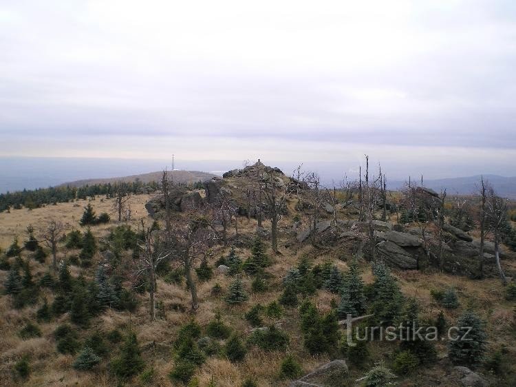 Summit: Summit rock from the rock with the remains of a log cabin