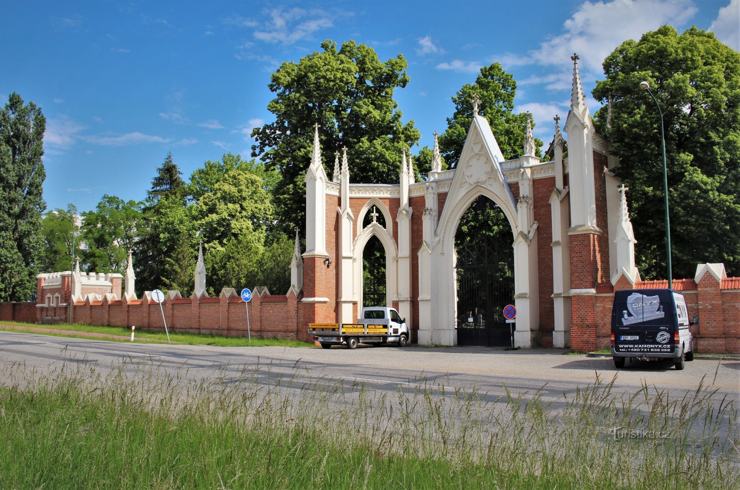 Entrance gate to the cemetery with a wall