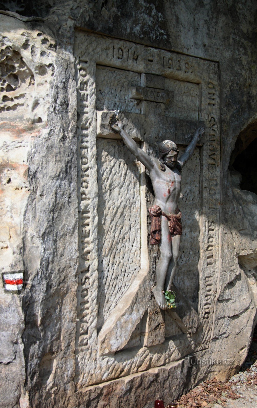 carved relief of the crucified Christ